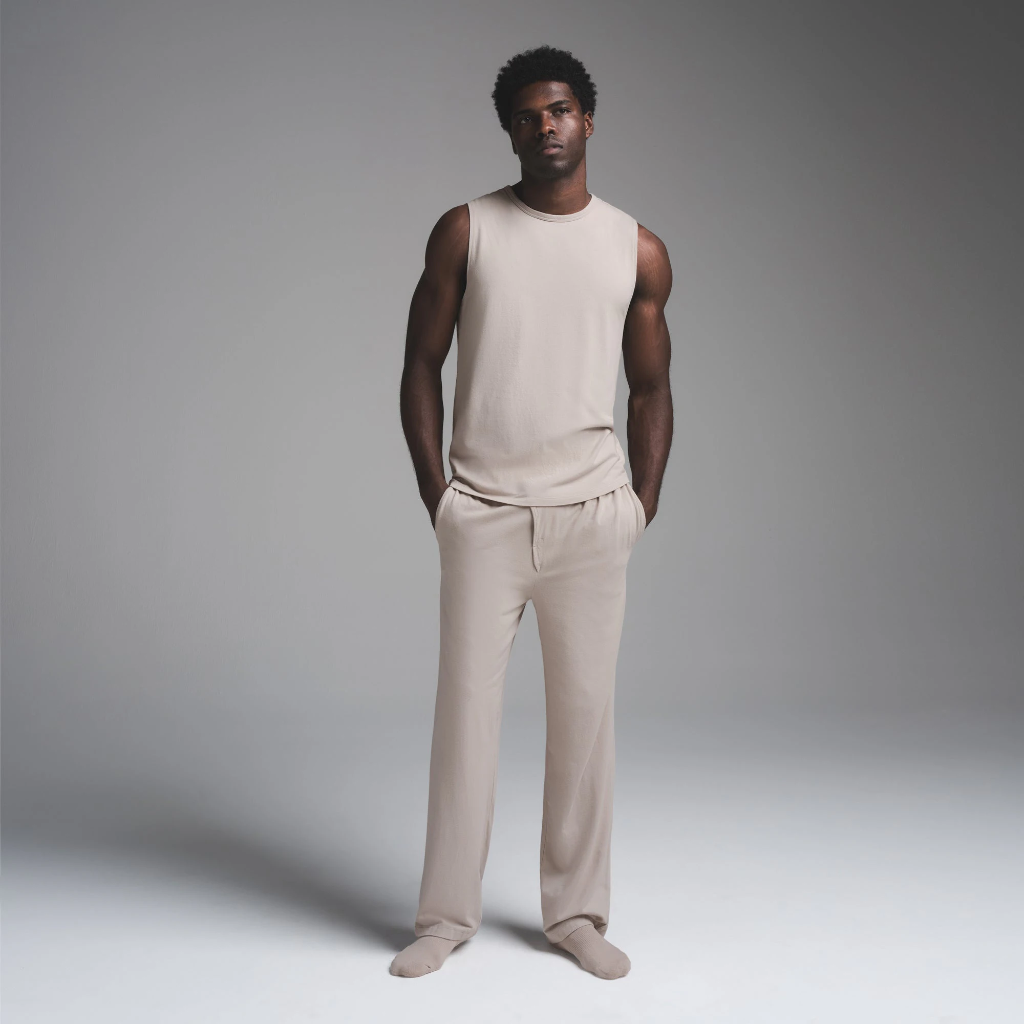 JERSEY SLEEP MENS TANK | STONE ON A MODEL FRONT VIEW | FOCUS: 0.0, 1.0, 0.9