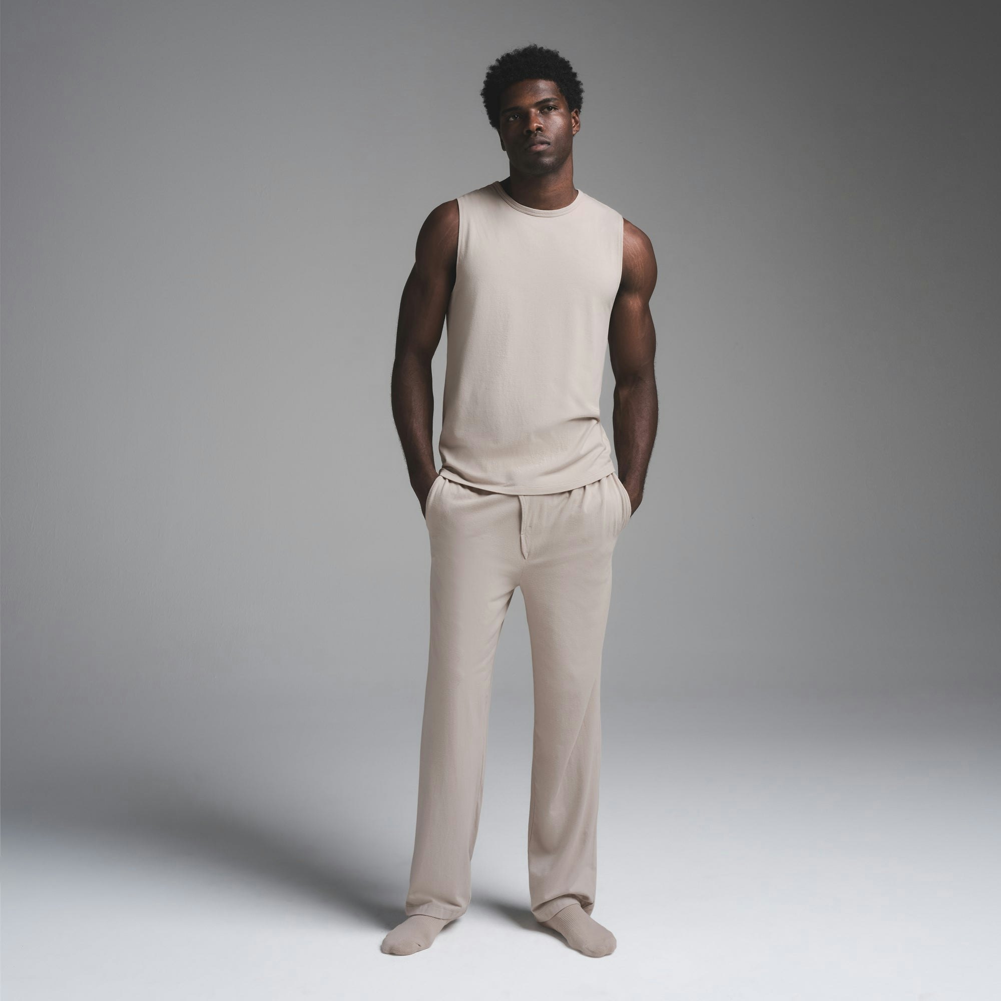 JERSEY SLEEP MENS TANK | STONE ON A MODEL FRONT VIEW | FOCUS: 0.0, 1.0, 0.9