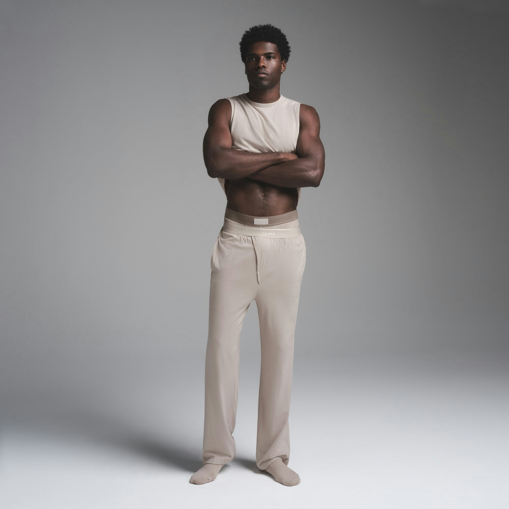 JERSEY SLEEP MENS TANK | STONE ON A MODEL FRONT VIEW