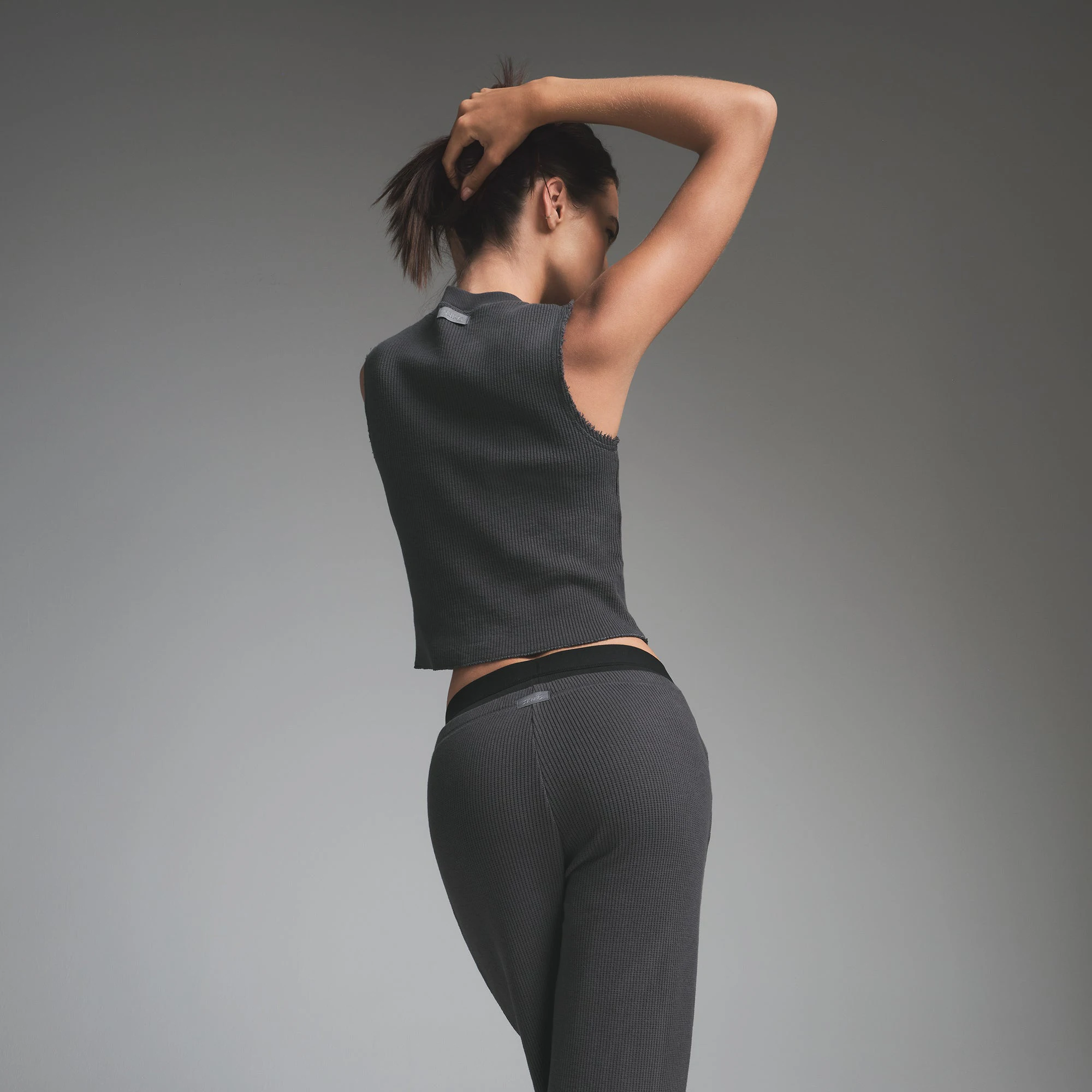 HEAVY WAFFLE CROPPED TANK | ASH ON A MODEL BACK VIEW | FOCUS: 0.9, 0.1, 0.7