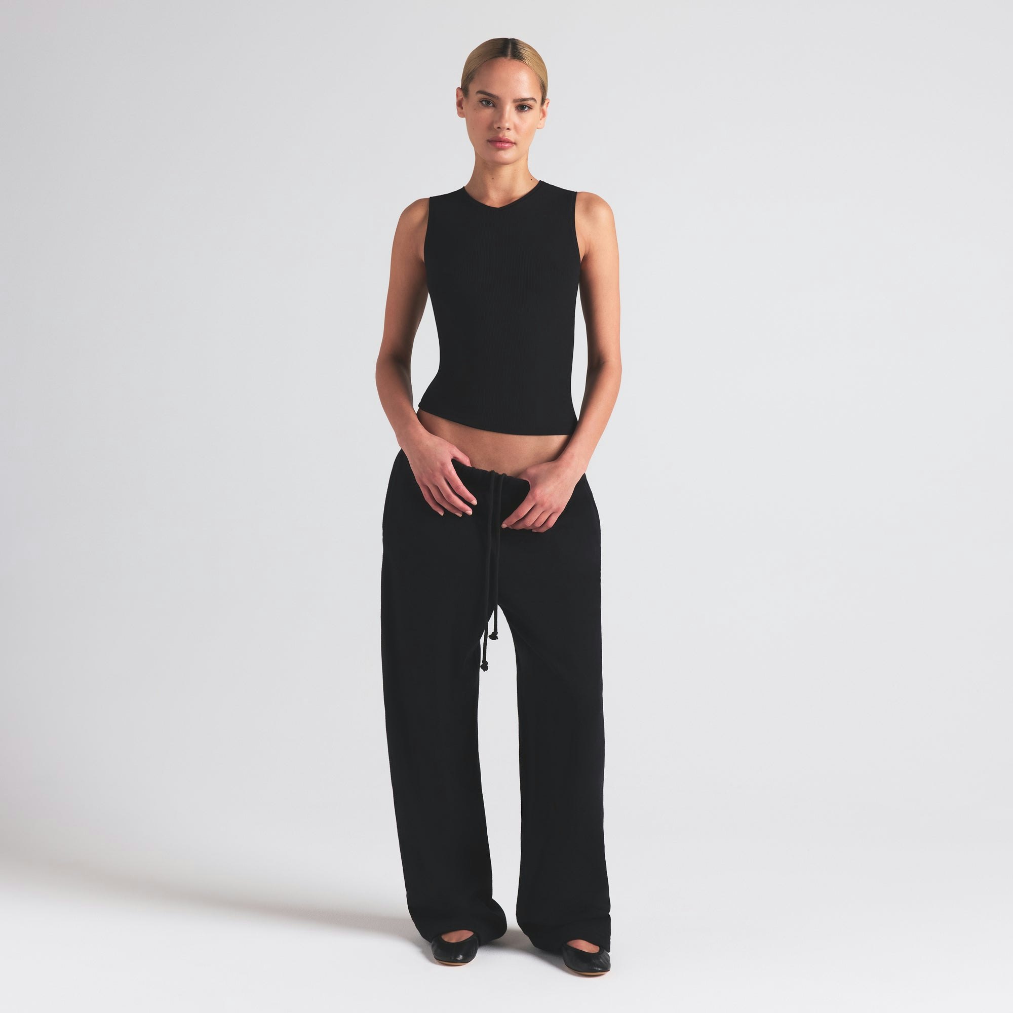 SOFT LOUNGE V NECK TANK | ONYX ON A MODEL FRONT VIEW | FOCUS: 0.0, 1.0, 0.9