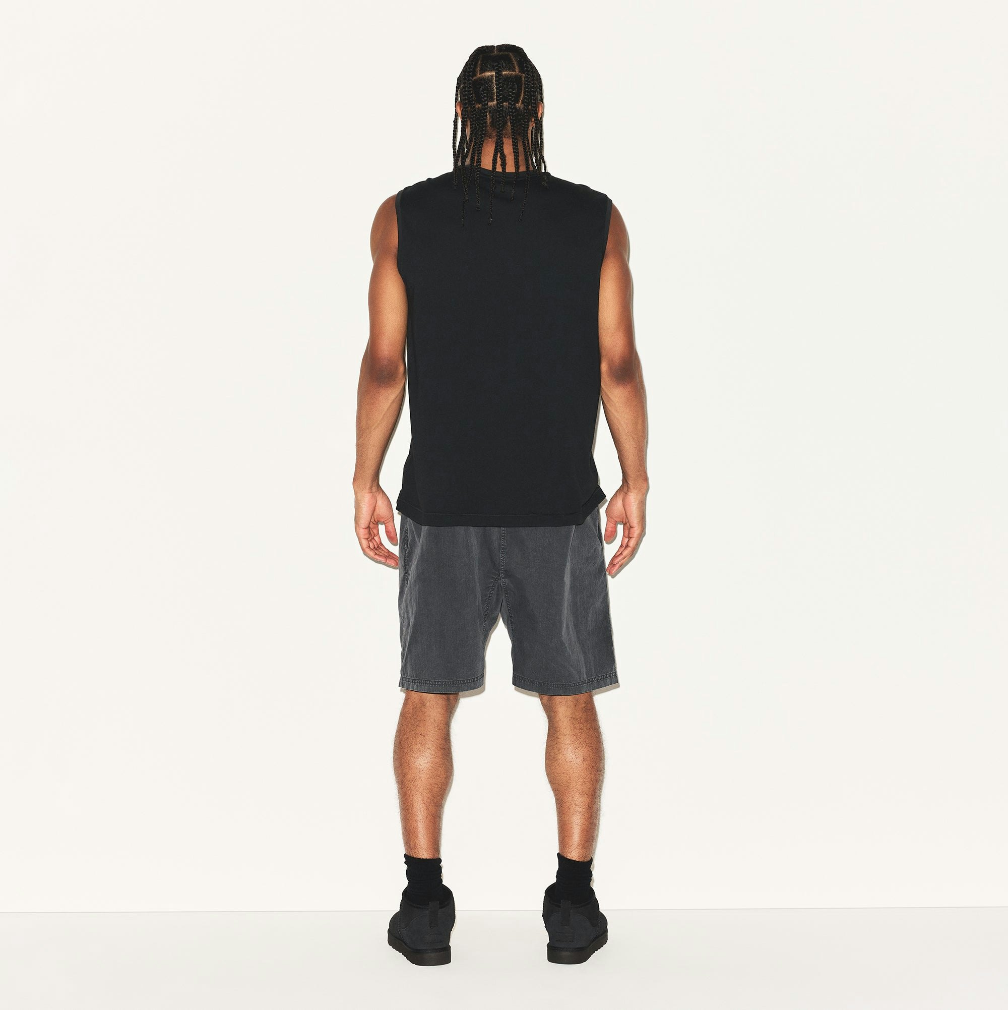 SKIMS COTTON MENS RELAXED SLEEVELESS SHIRT | ONYX ON A MODEL BACK VIEW | FOCUS: 0.0, 1.0, 0.9