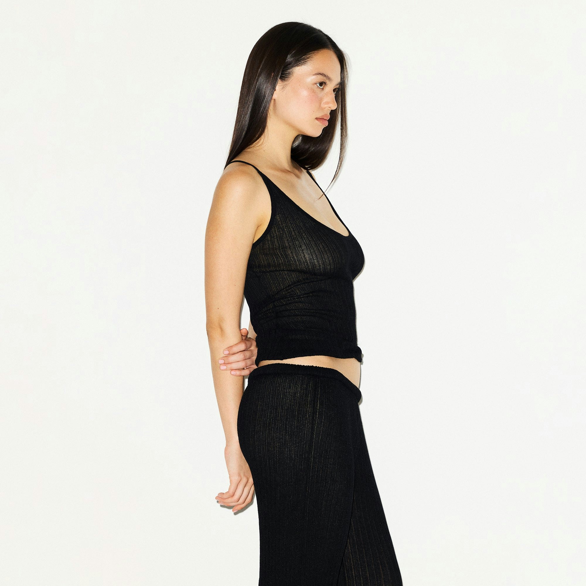SHEER KNIT TANK | ONYX ON A MODEL SIDE VIEW @ | FOCUS: 0.0, 1.0, 0.9