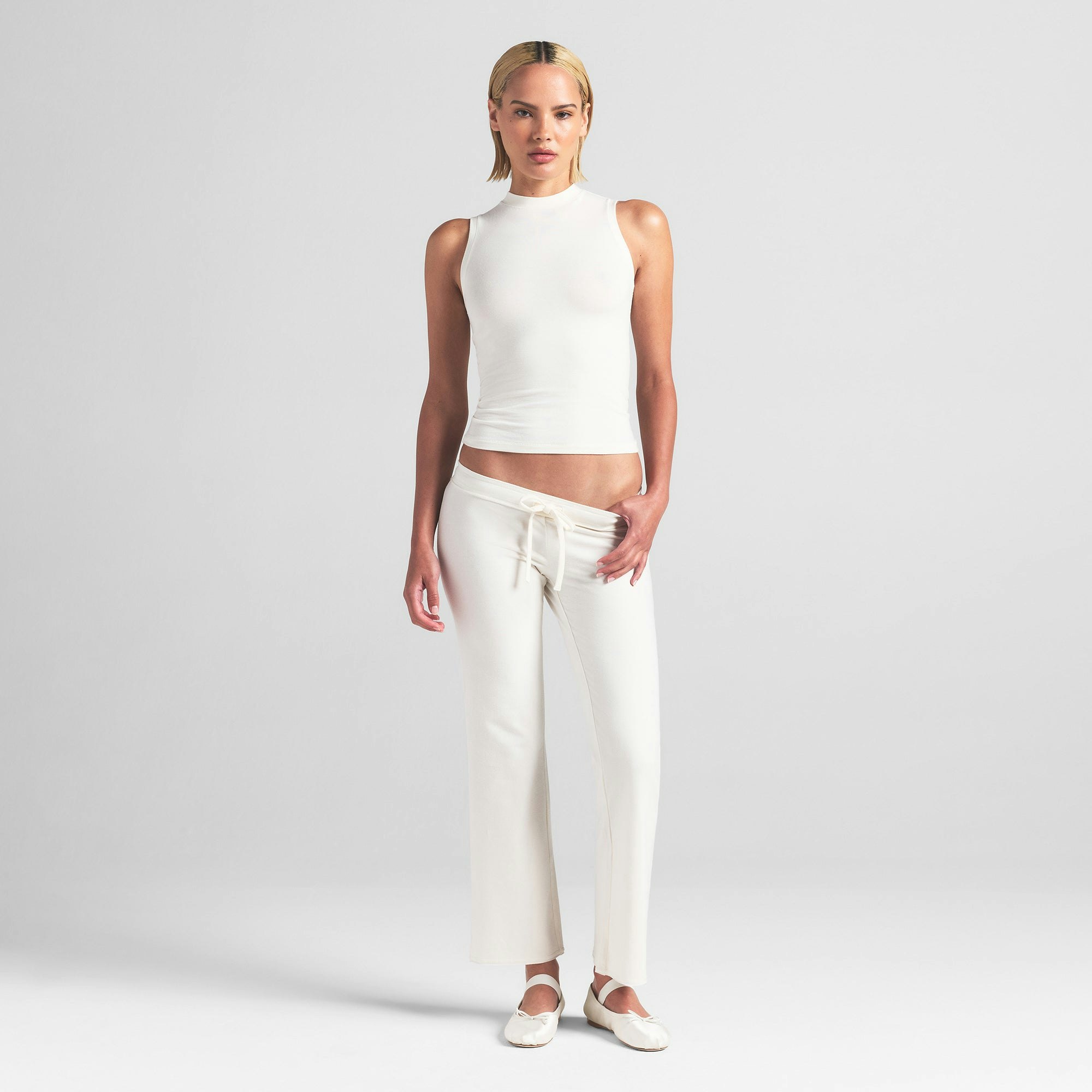 COTTON JERSEY MOCK NECK TANK | MARBLE ON A MODEL FRONT VIEW | FOCUS: 0.0, 1.0, 0.9