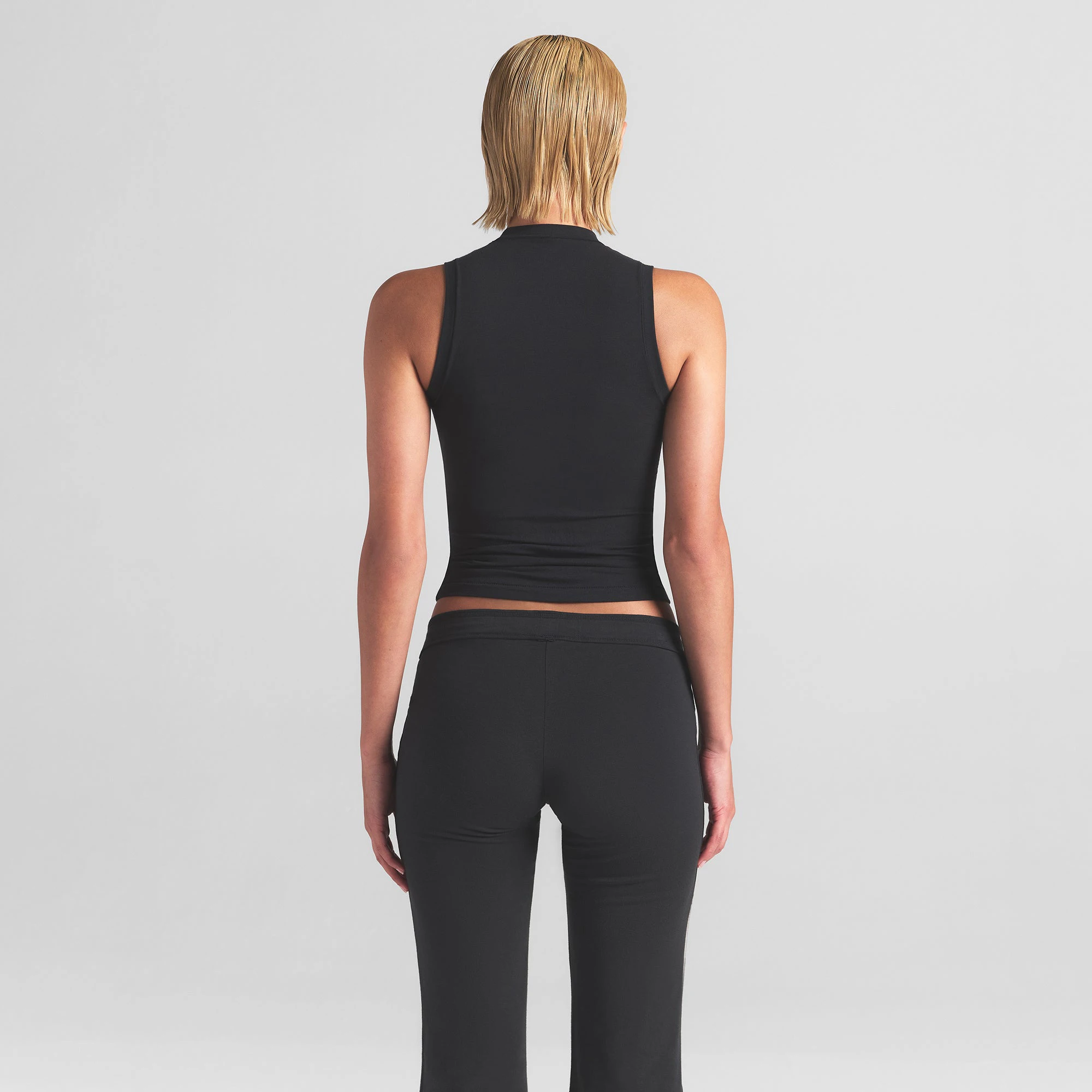 COTTON JERSEY MOCK NECK TANK | SOOT ON A MODEL BACK VIEW | FOCUS: 0.0, 1.0, 0.9
