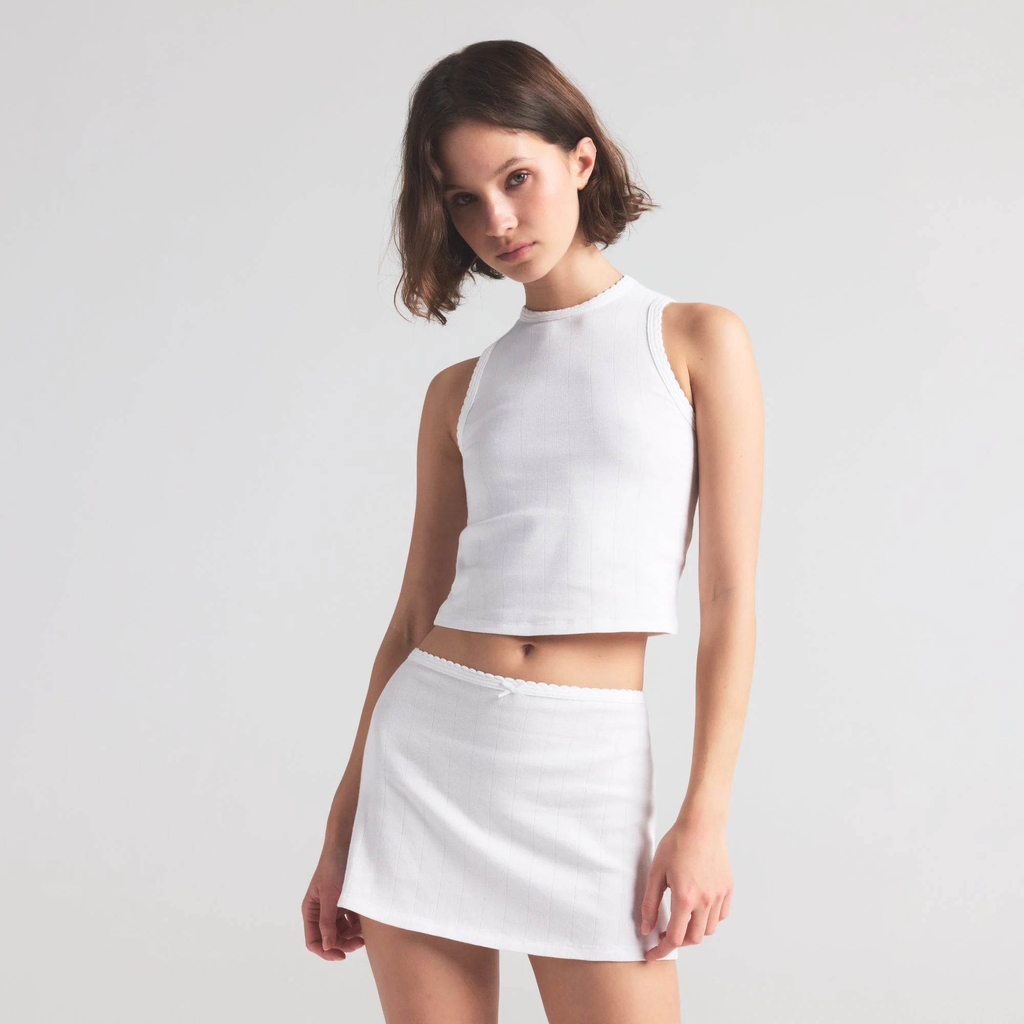 DROP NEEDLE POINTELLE CROPPED TANK | SNOW ON A MODEL FRONT VIEW | FOCUS: 0.0, 1.0, 0.9