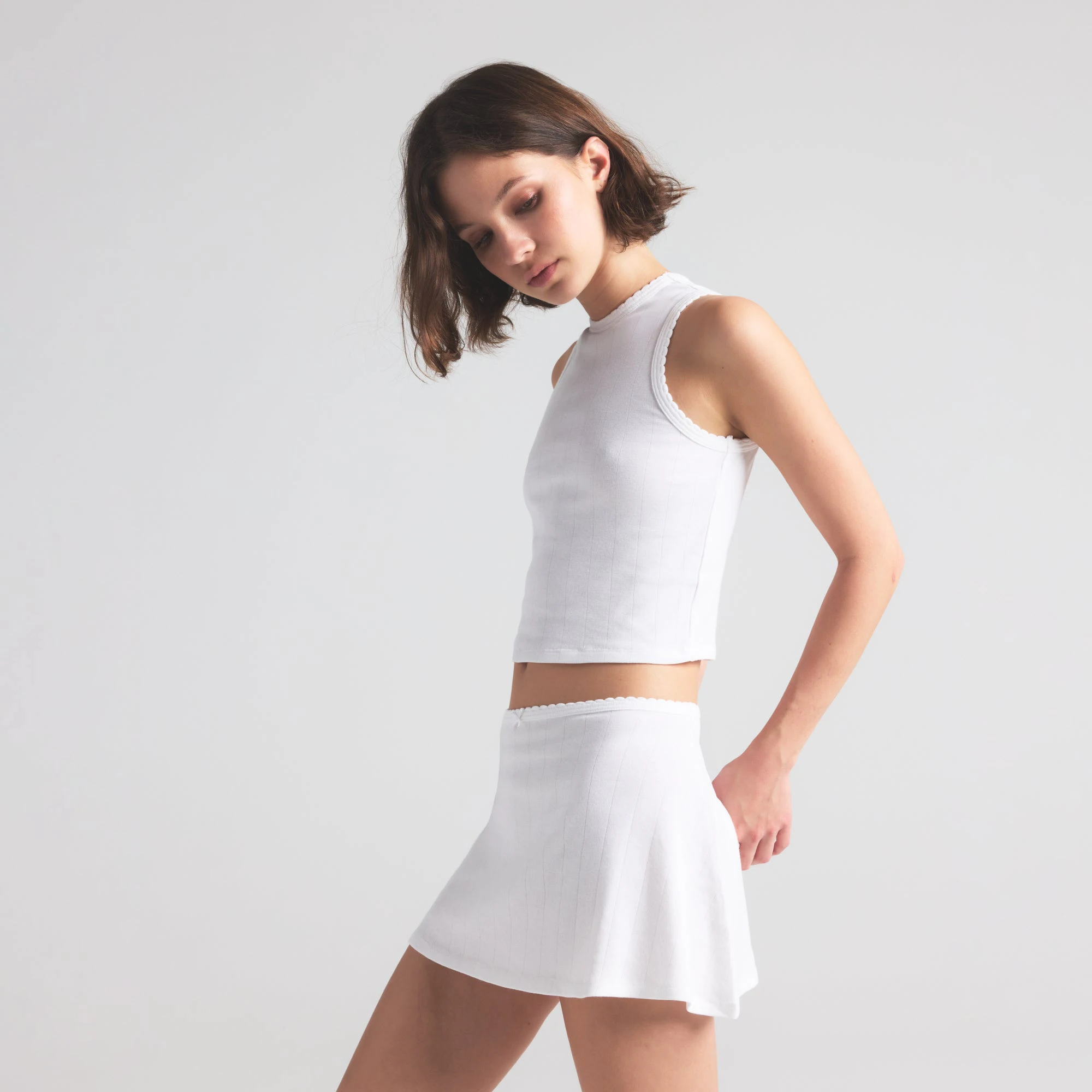 DROP NEEDLE POINTELLE CROPPED TANK | SNOW ON A MODEL FRONT VIEW | FOCUS: 0.0, 1.0, 0.9