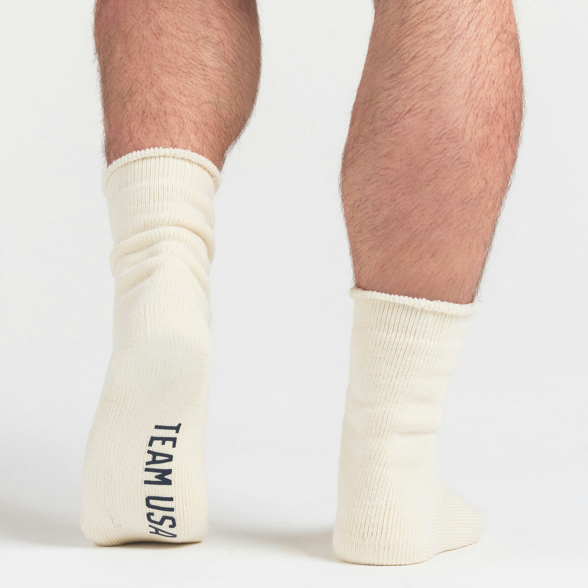 SKIMS FOR TEAM USA MENS OLYMPIC LOUNGE SOCK | ECRUON A MODEL FRONT VIEW @ | FOCUS: 0.0, 1.0, 0.9