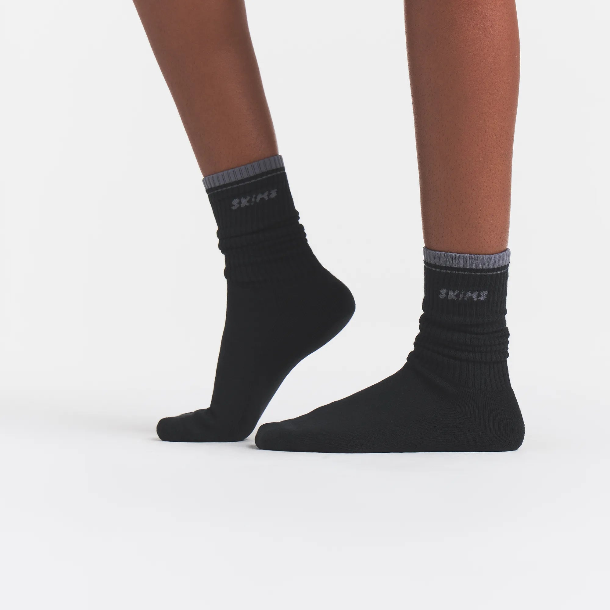 RIBBED CREW LOGO SOCK | ONYX AND DARK HEATHER GREY ON A MODEL | FOCUS: 0.0, 1.0, 0.9