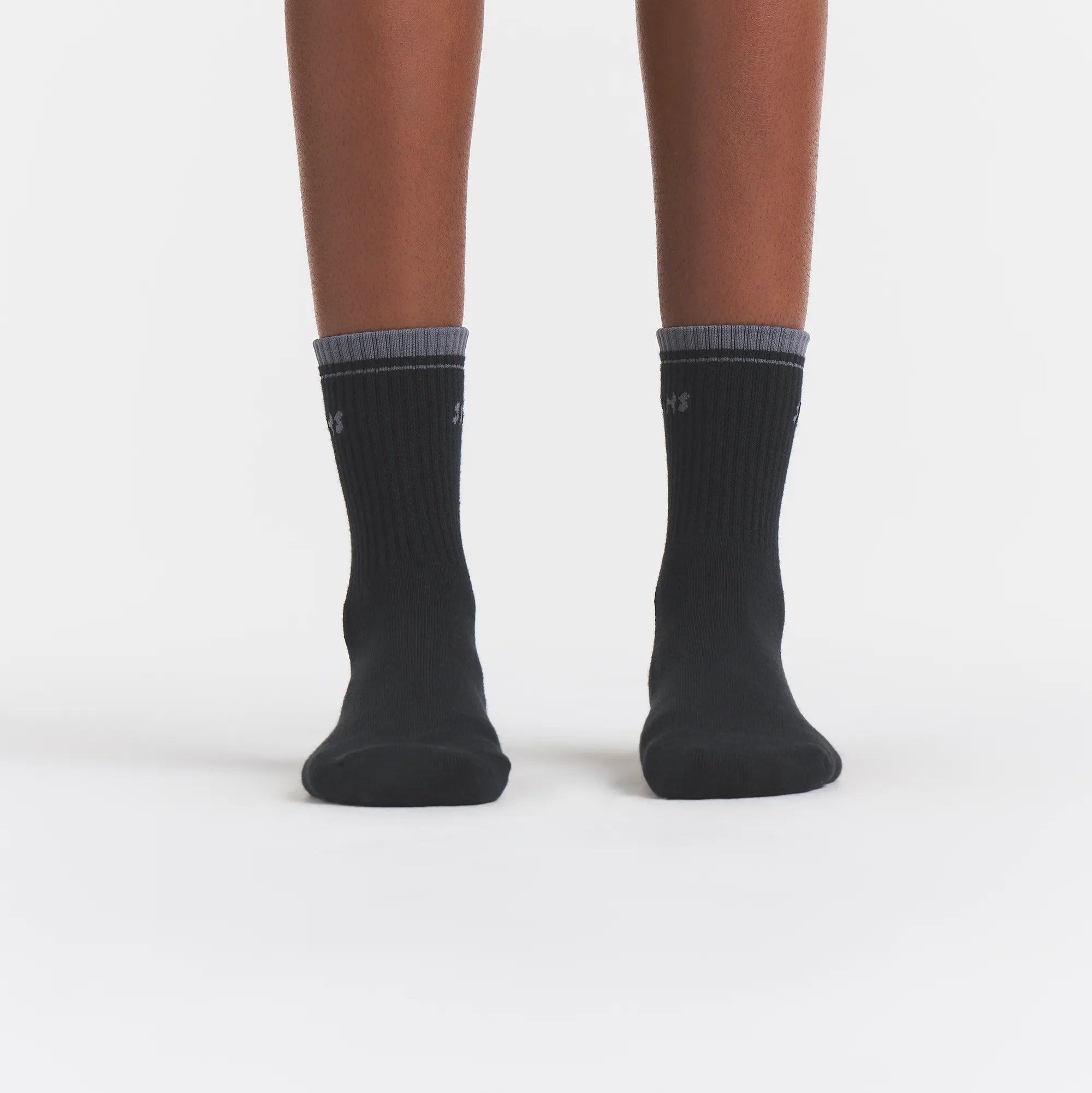 RIBBED QUARTER CREW LOGO SOCK | ONYX AND DARK HEATHER GREY ON A MODEL | FOCUS: 0.0, 1.0, 0.9