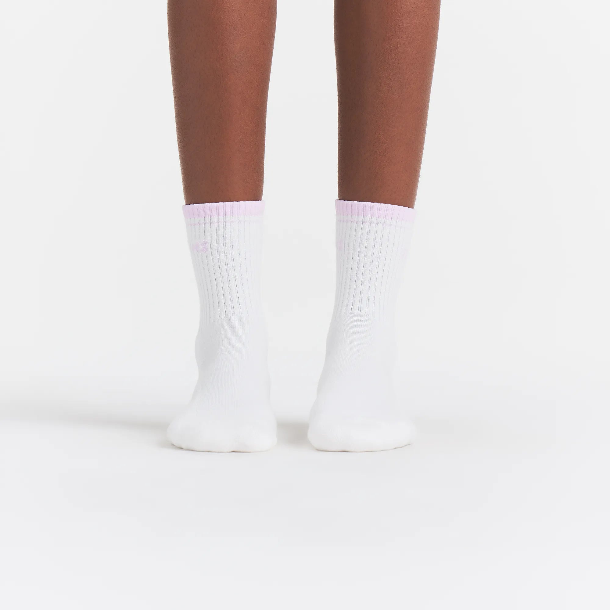 RIBBED QUARTER CREW LOGO SOCK | SNOW AND CHERRY BLOSSOM ON A MODEL | FOCUS: 0.0, 1.0, 0.9
