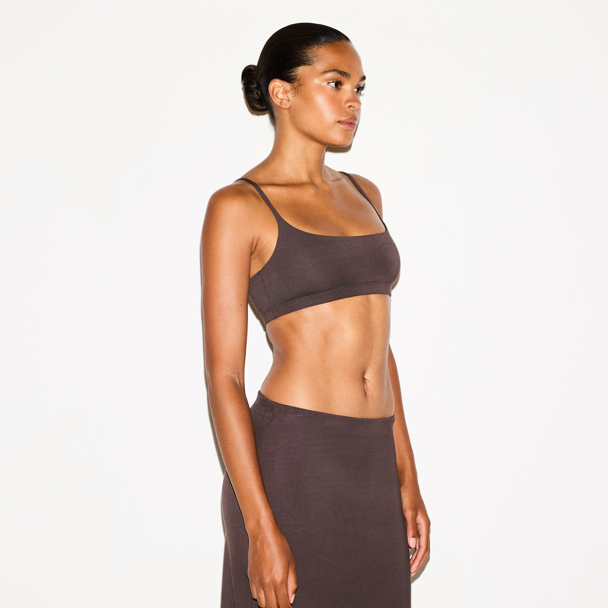 SMOOTH LAYERS SCOOP BRALETTE | RAISIN ON A MODEL SIDE VIEW @ | FOCUS: 0.0, 1.0, 0.9