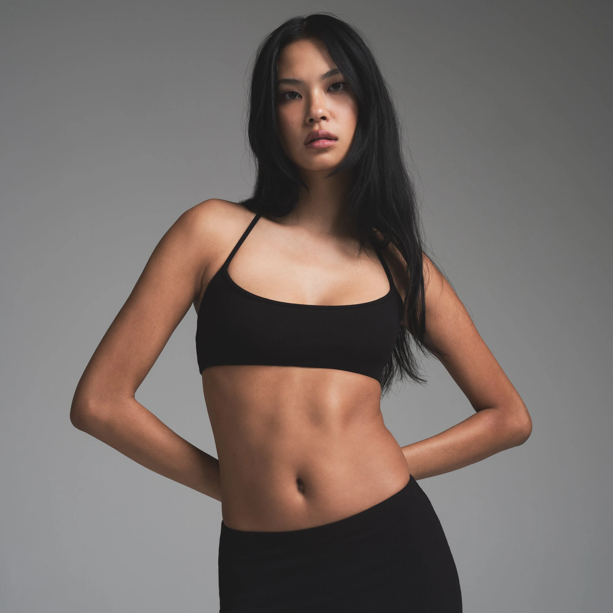 SOFT LOUNGE HALTER SCOOP  BRALETTE | ONYX ON A MODEL SIDE VIEW