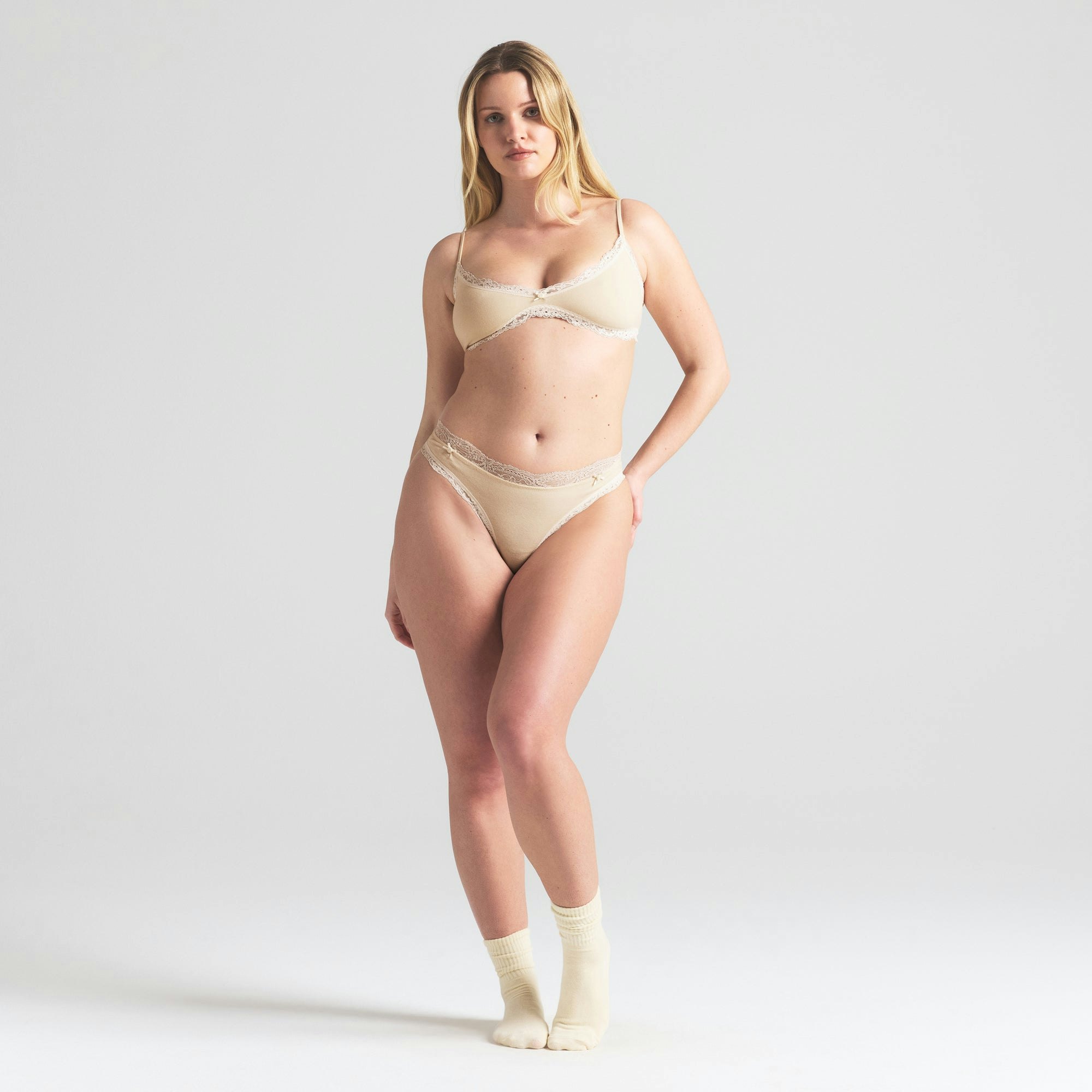 COTTON JERSEY LACE SKIMPY SCOOP BRALETTE | BUTTER ON A MODEL FRONT VIEW | FOCUS: 0.0, 1.0, 0.9