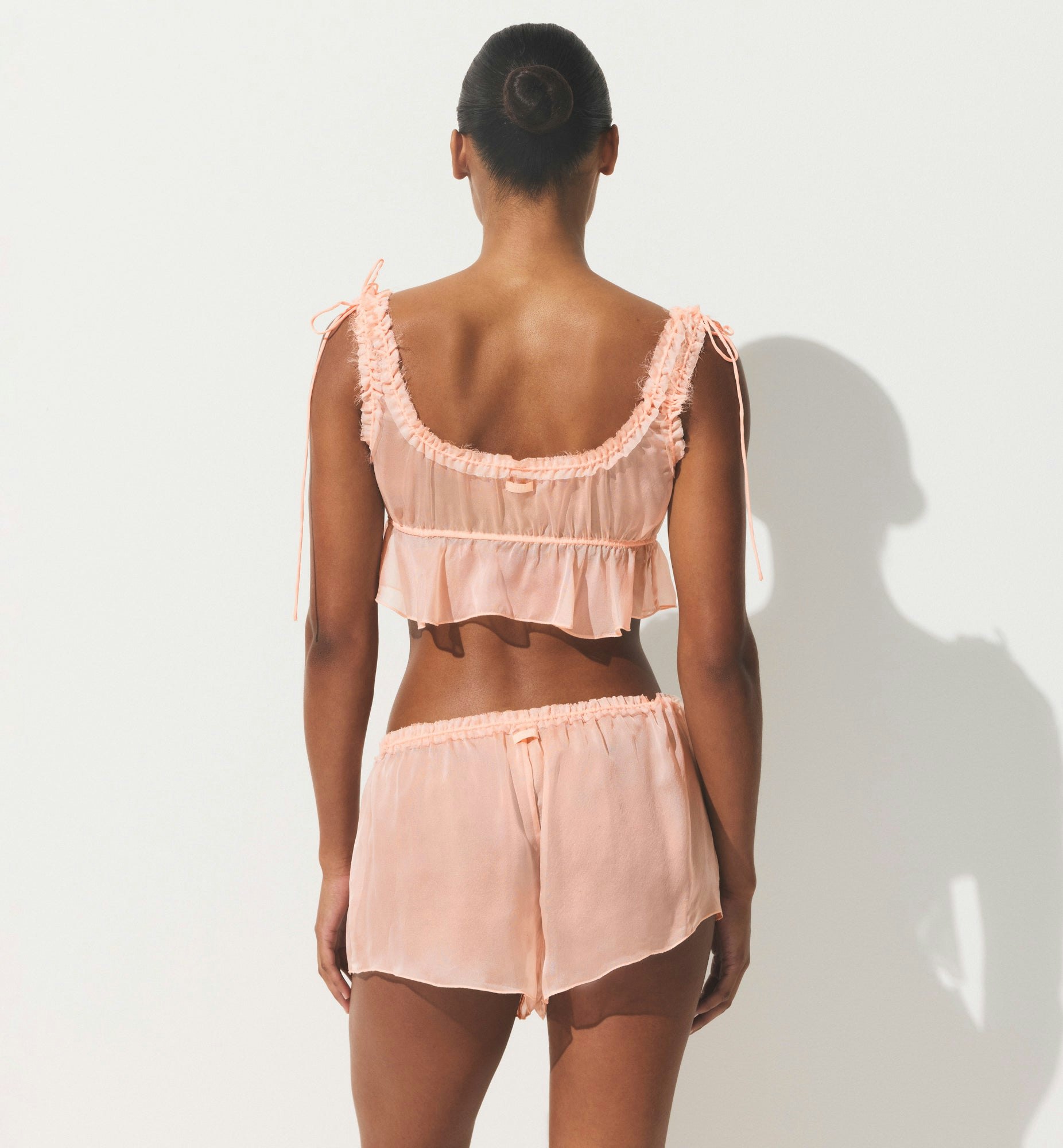 SKIMS ROMANCE BABYDOLL AND SHORT SET | PRIMROSE ON A MODEL SIDE VIEW | FOCUS: 0.0, 1.0, 0.9