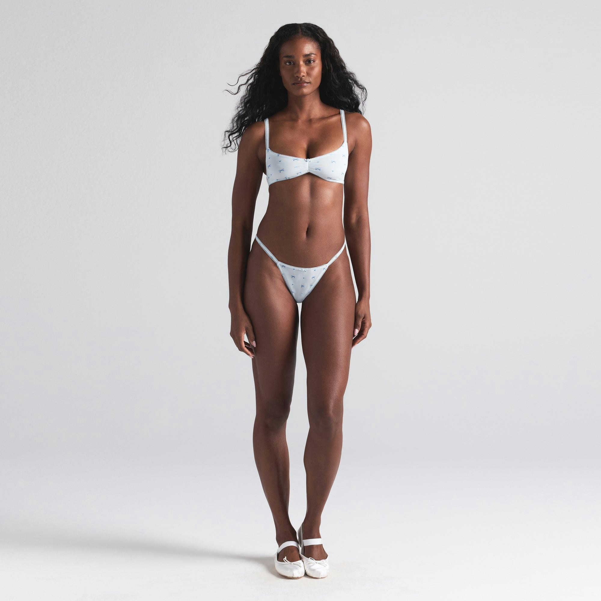 FITS EVERYBODY PICOT SKIMPY SCOOP BRALETTE 2-PACK | MARBLE AND CLOUD BOW PRINT ON A MODEL FRONT  ON A MODEL FRONT VIEW | FOCUS: 0.0, 1.0, 0.9