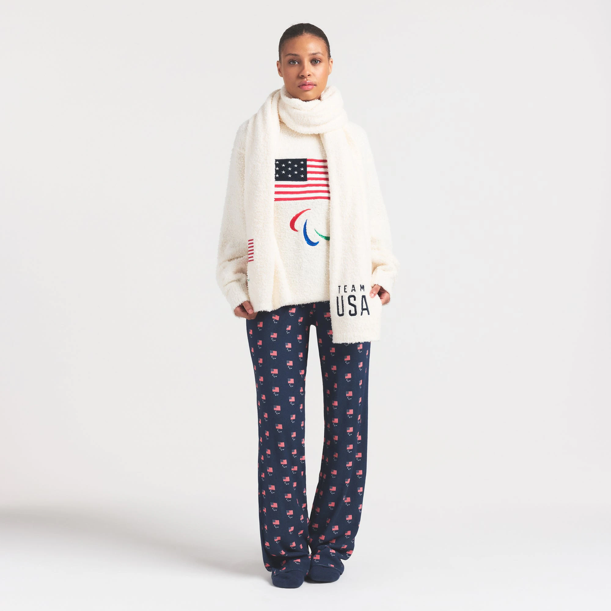 SKIMS FOR TEAM USA COZY PARALYMPIC SCARF | ECRU ON A MODEL FRONT VIEW @ | FOCUS: 0.0, 1.0, 0.9