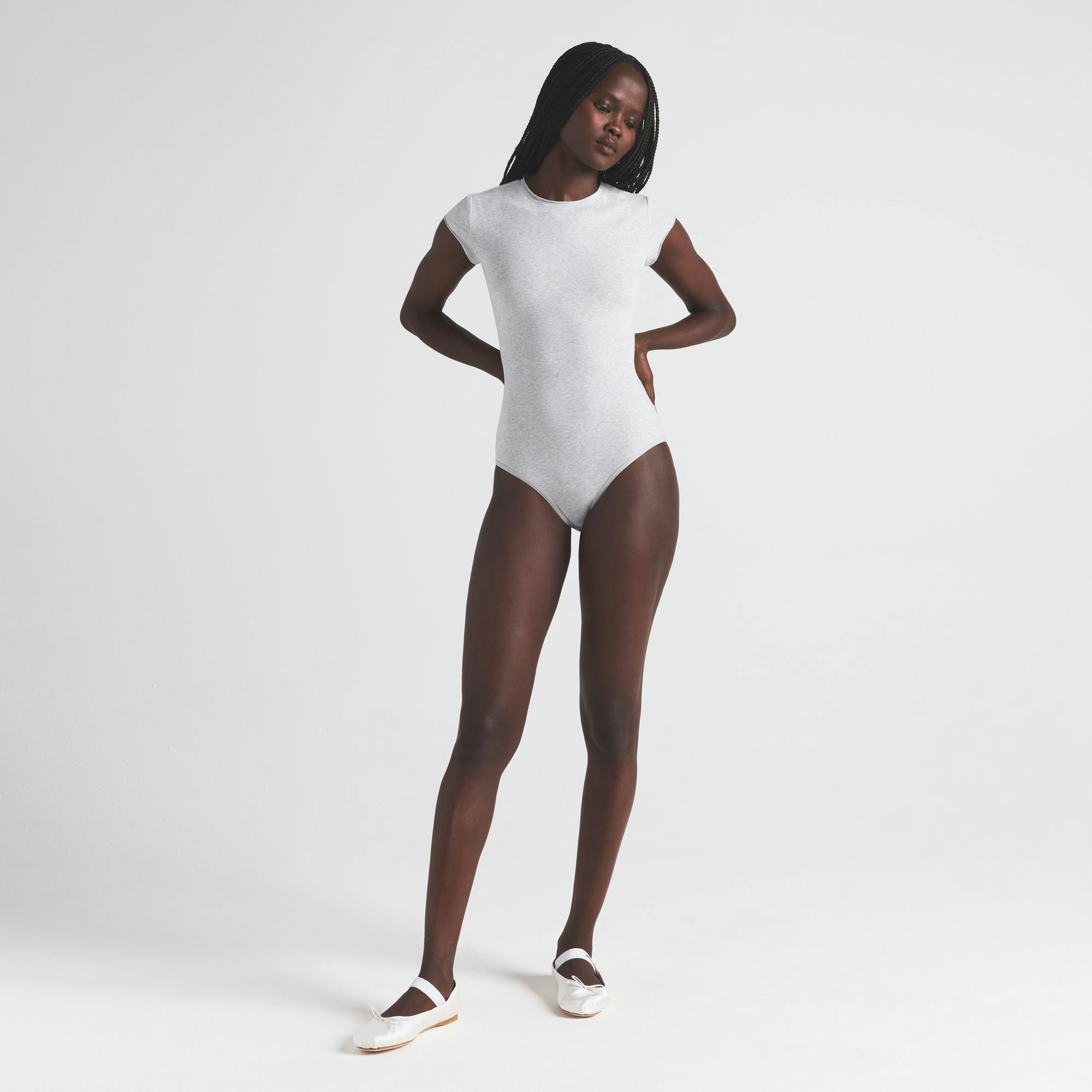 COTTON JERSEY T-SHIRT BRIEF BODYSUIT | LIGHT HEATHER GREY ON A MODEL FRONT VIEW | FOCUS: 0.0, 1.0, 0.9