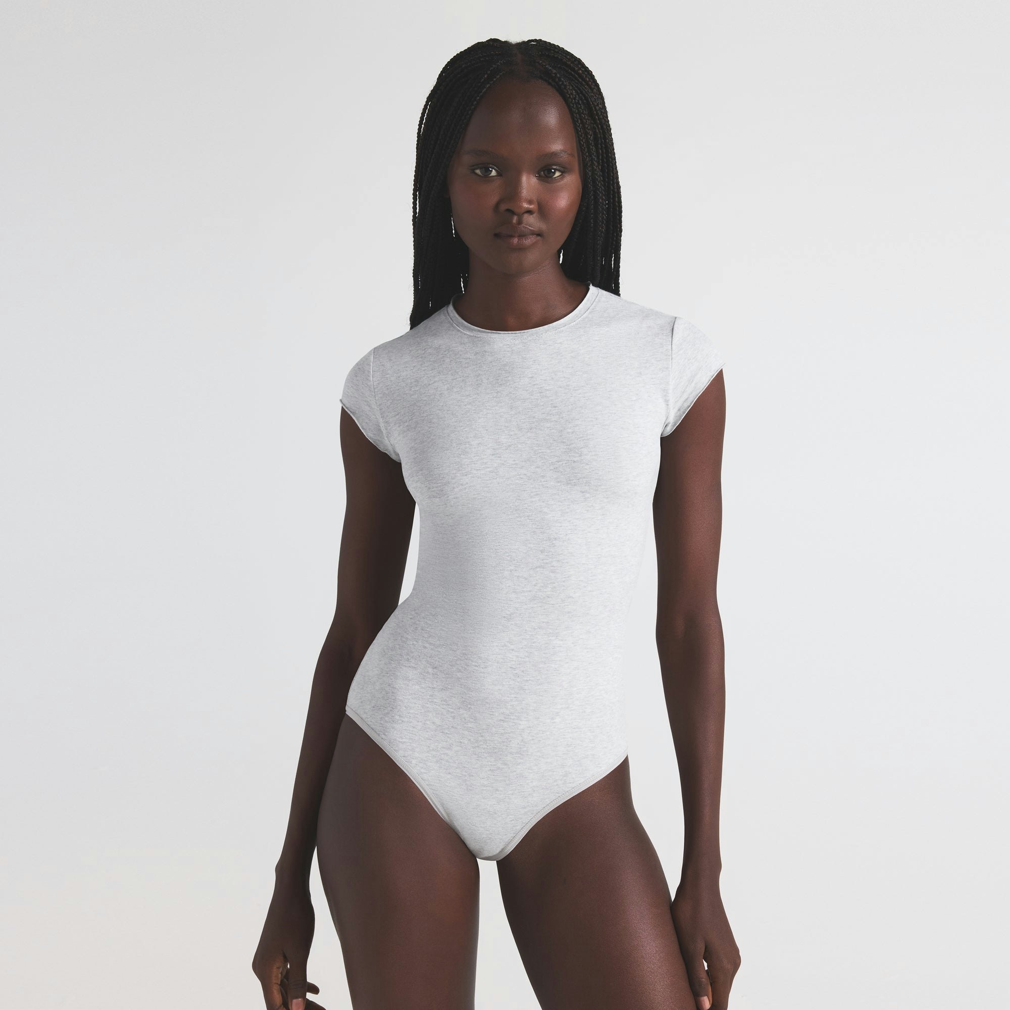 COTTON JERSEY T-SHIRT BRIEF BODYSUIT | LIGHT HEATHER GREY ON A MODEL SIDE VIEW | FOCUS: 0.0, 1.0, 0.9