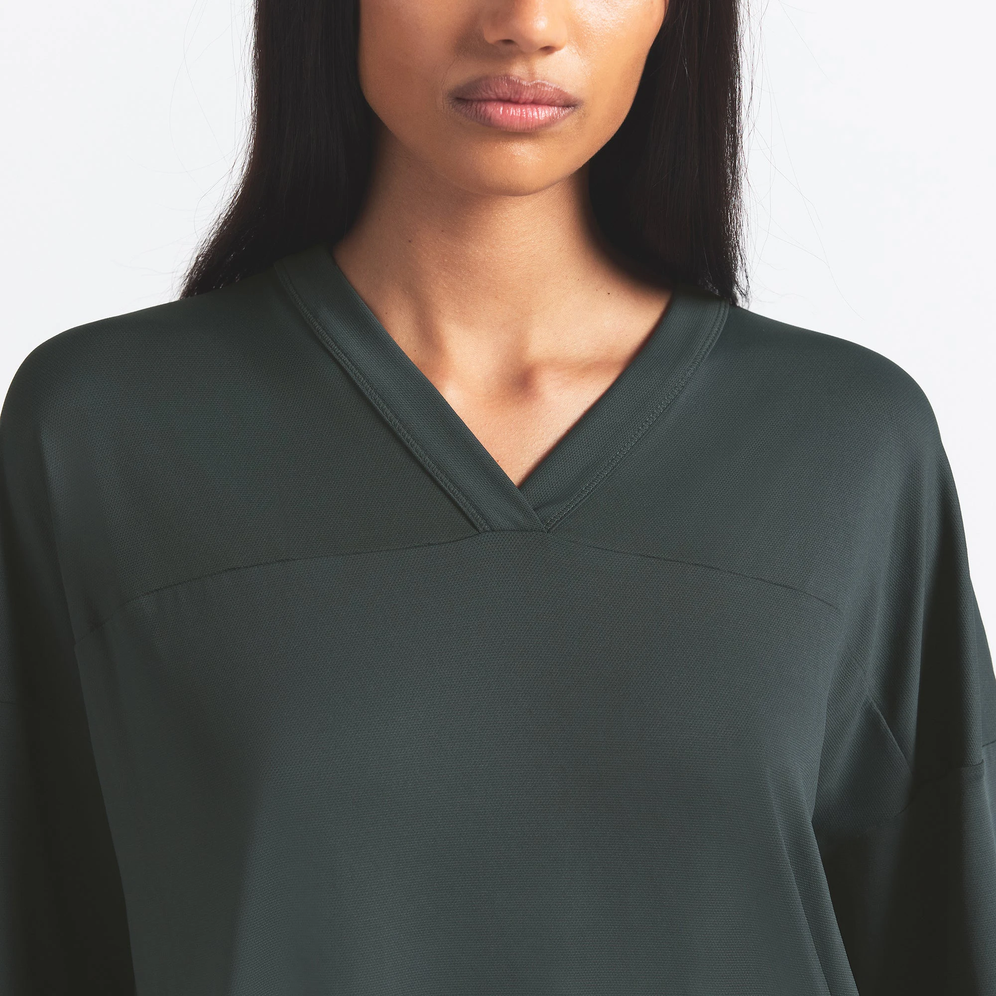 NikeSKIMS AIRY V-NECK OVERSIZED TOP | DARK TEAL ON A MODEL SIDE VIEW @ | FOCUS: 0.0, 1.0, 0.9