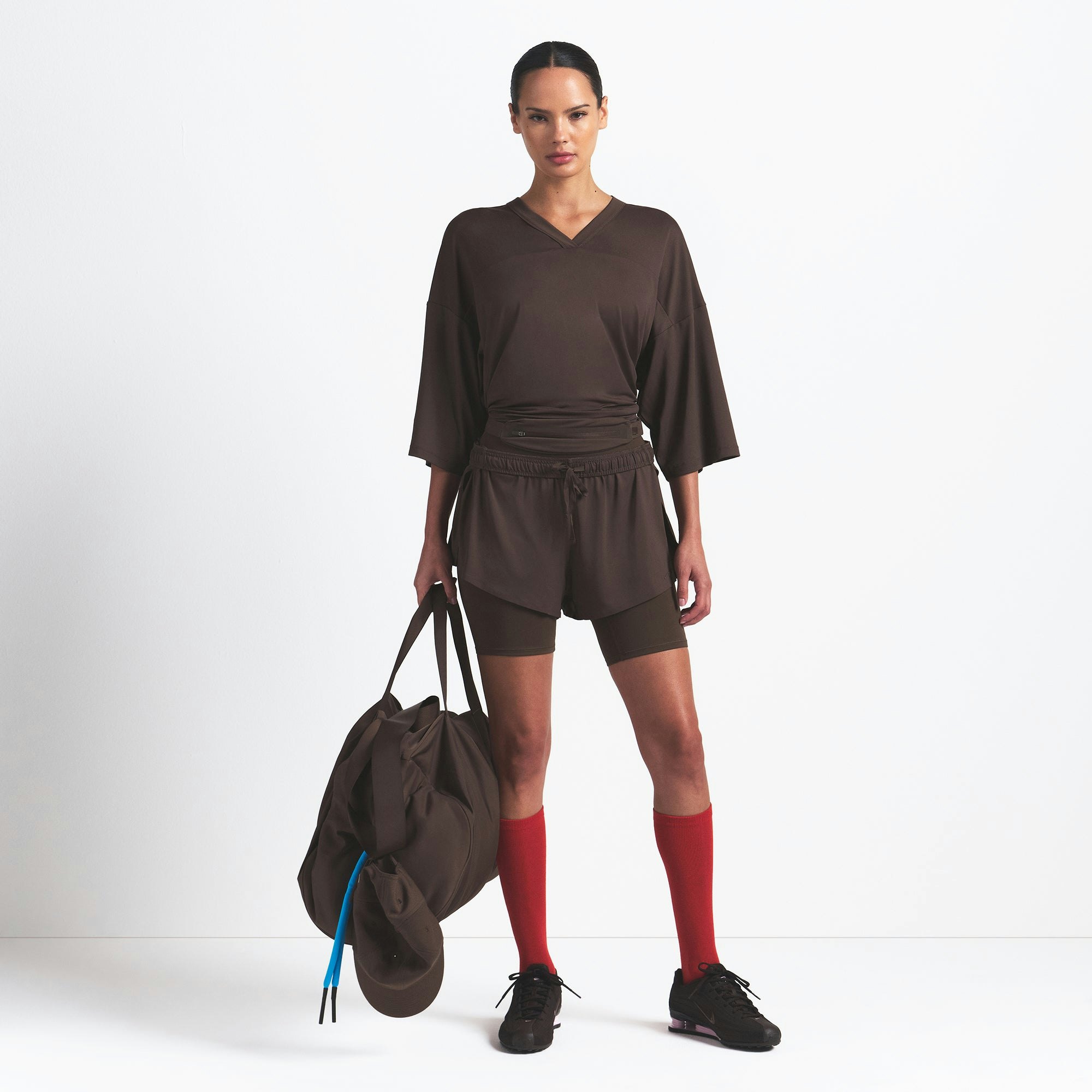 NikeSKIMS AIRY V-NECK OVERSIZED TOP | DARK SEPIA ON A MODEL FRONT VIEW @ | FOCUS: 0.9, 0.1, 0.7