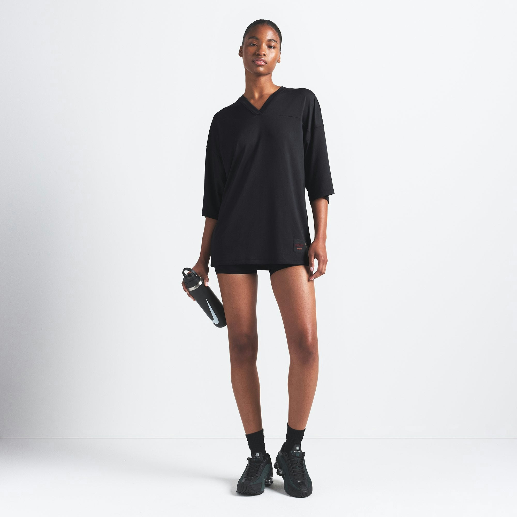 NikeSKIMS AIRY V-NECK OVERSIZED TOP | OBSIDIAN ON A MODEL FRONT VIEW @ | FOCUS: 0.9, 0.1, 0.7