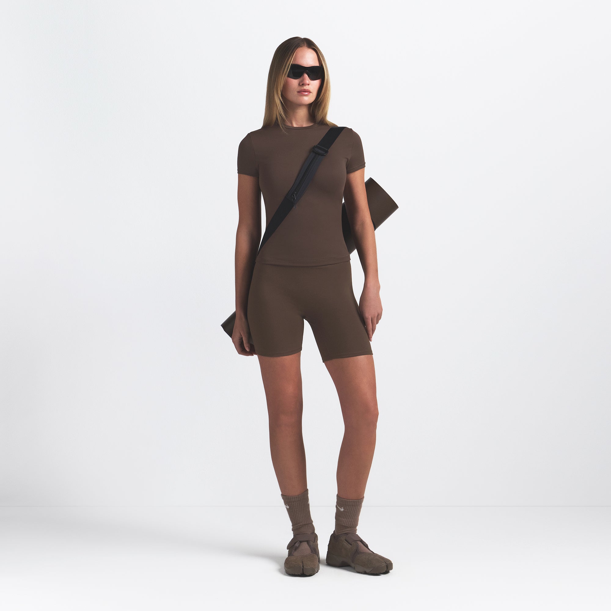 NikeSKIMS MATTE PADDED BABY TEE | DARK SEPIA ON A MODEL FRONT VIEW @ | FOCUS: 0.0, 1.0, 0.9