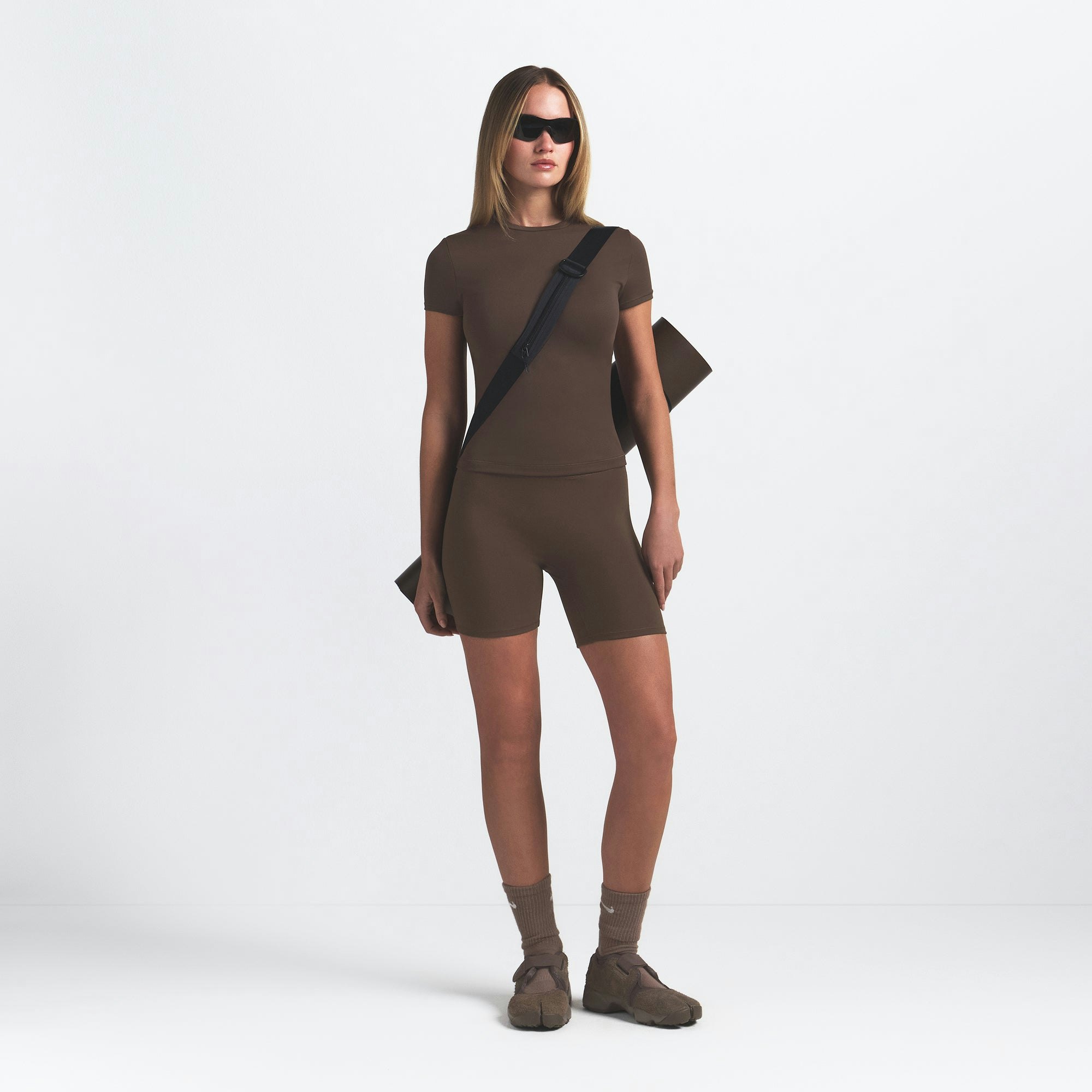 NikeSKIMS MATTE PADDED BABY TEE | DARK SEPIA ON A MODEL FRONT VIEW @ | FOCUS: 0.0, 1.0, 0.9