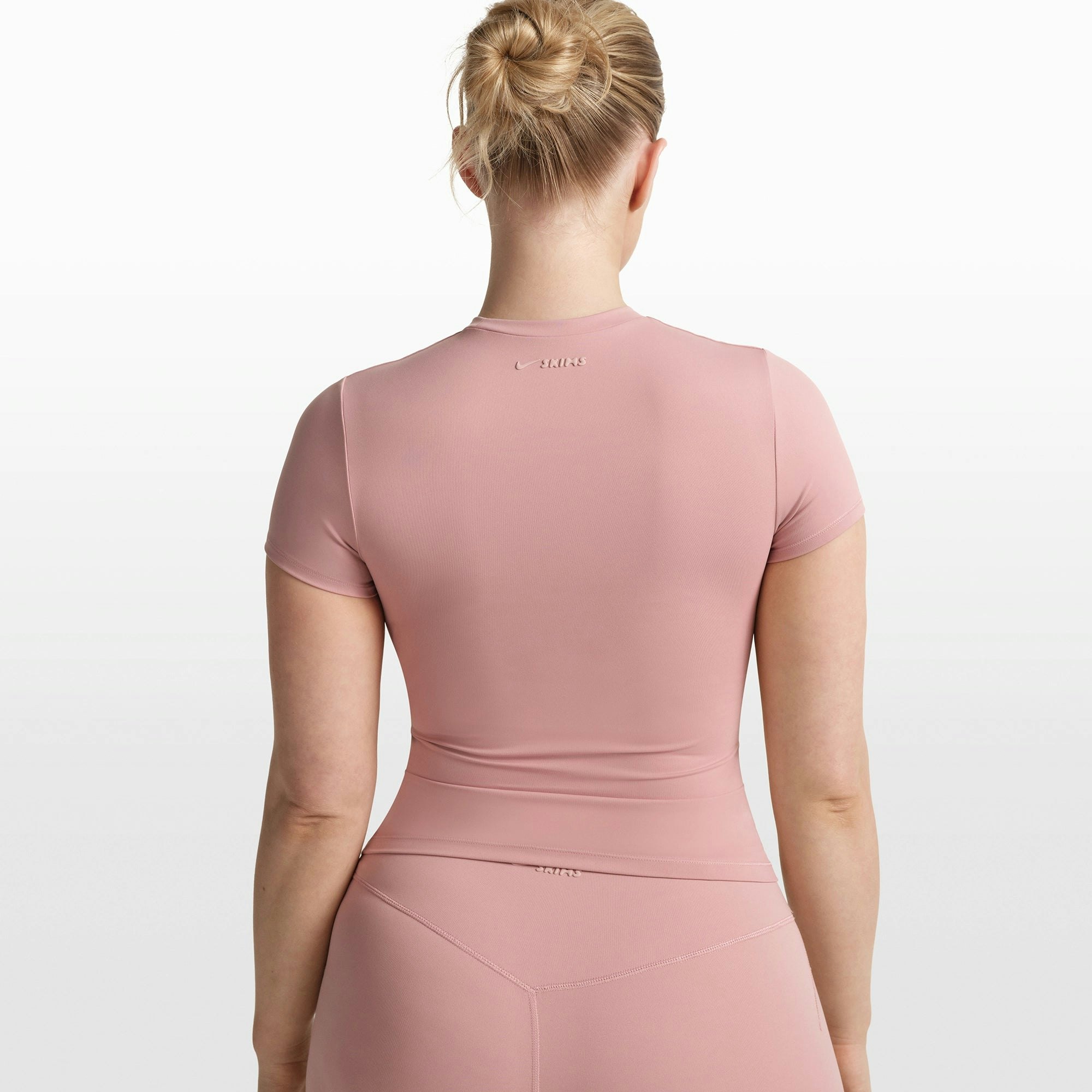 NikeSKIMS MATTE PADDED BABY TEE | HIMALAYAN ON A MODEL FRONT VIEW @ | FOCUS: 0.0, 1.0, 0.9