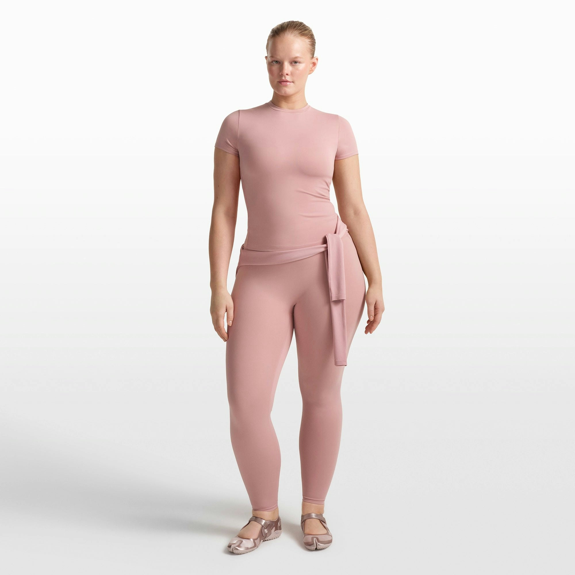 NikeSKIMS MATTE PADDED BABY TEE | HIMALAYAN ON A MODEL FRONT VIEW @ | FOCUS: 0.0, 1.0, 0.9