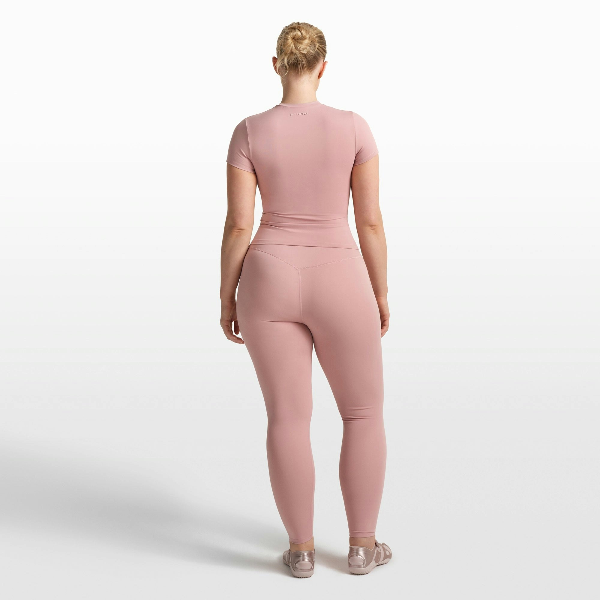 NikeSKIMS MATTE PADDED BABY TEE | HIMALAYAN ON A MODEL FRONT VIEW @ | FOCUS: 0.0, 1.0, 0.9