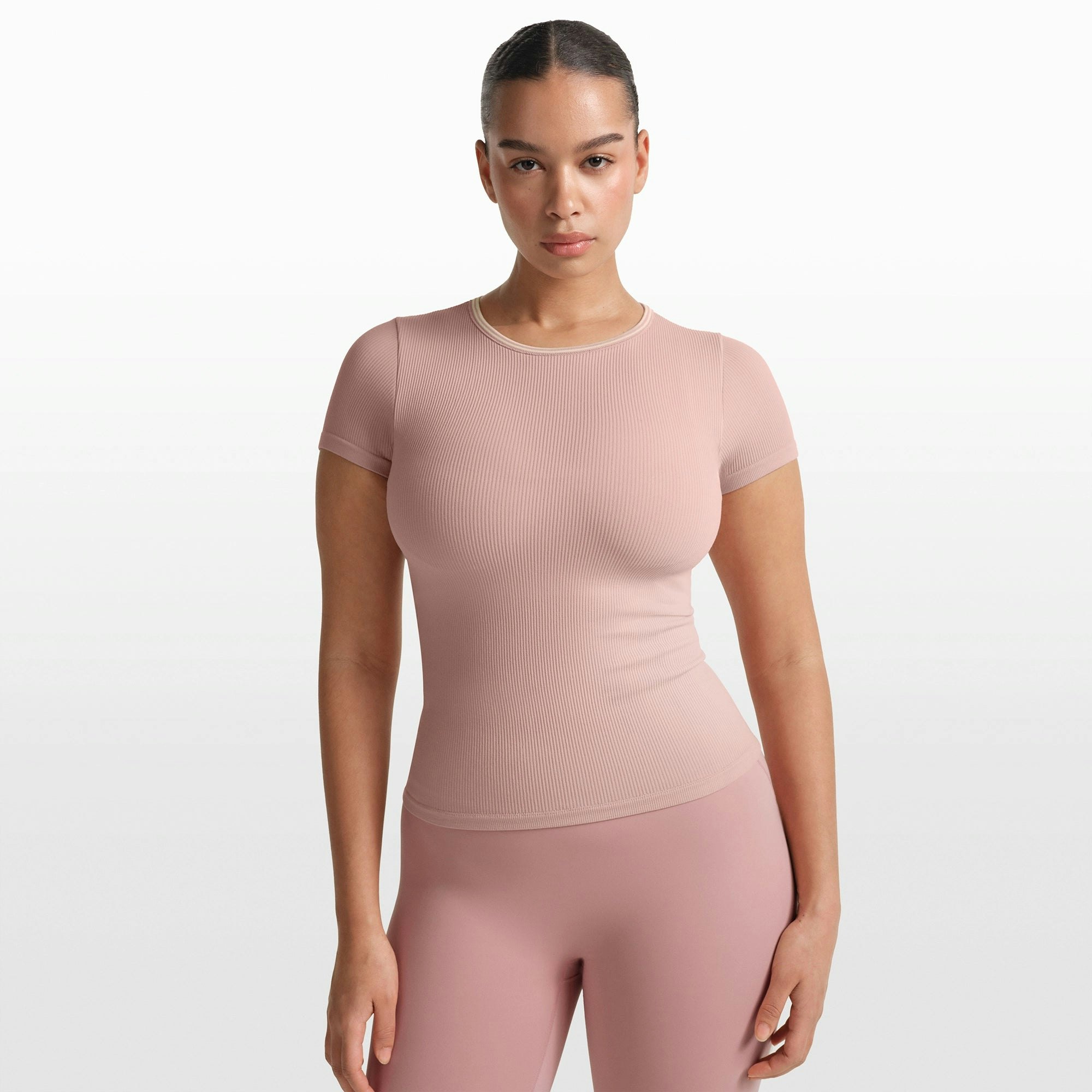 NikeSKIMS RIBBED SEAMLESS BABY TEE | HIMALAYAN ON A MODEL FRONT VIEW @ | FOCUS: 0.0, 1.0, 0.9