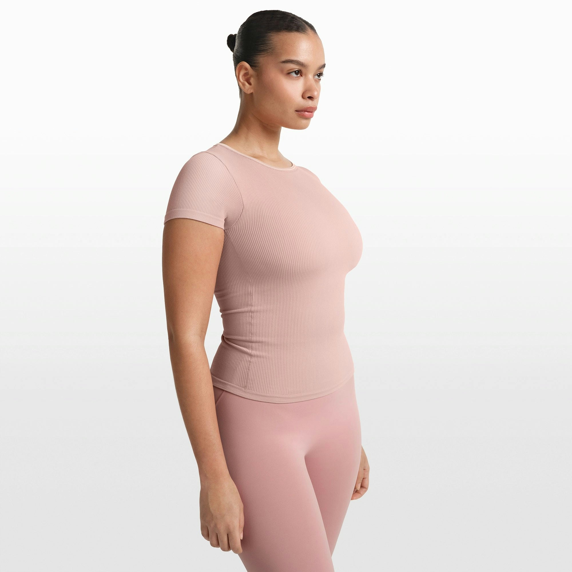 NikeSKIMS RIBBED SEAMLESS BABY TEE | HIMALAYAN ON A MODEL FRONT VIEW @ | FOCUS: 0.0, 1.0, 0.9