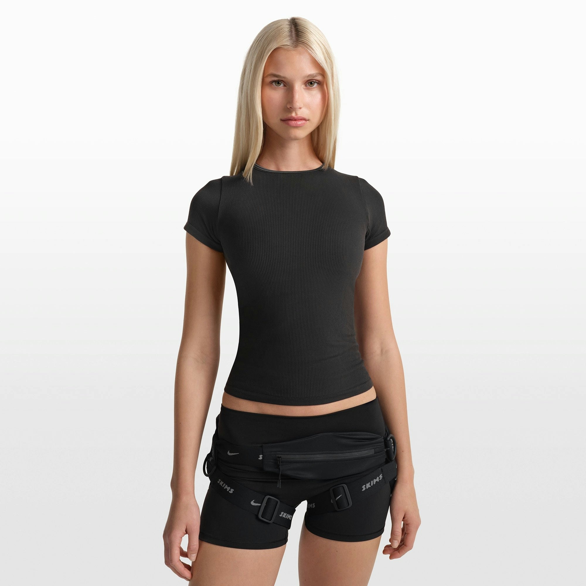 NikeSKIMS RIBBED SEAMLESS BABY TEE | OBSIDIAN/ARMOR ON A MODEL FRONT VIEW @ | FOCUS: 0.0, 1.0, 0.9