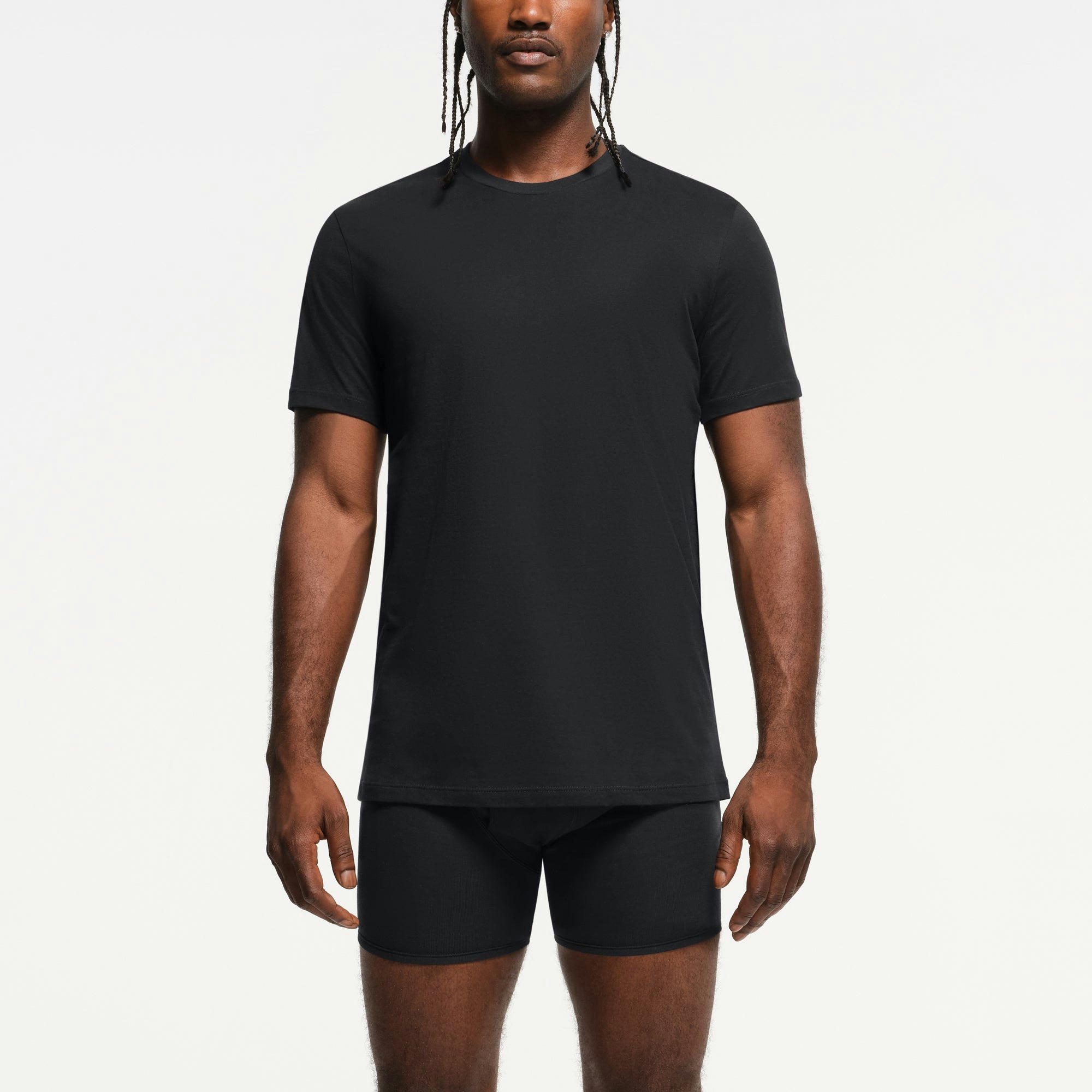 SKIMS BASICS MENS LIGHTWEIGHT T-SHIRT 3-PACK | OBSIDIAN ON A MODEL FRONT VIEW