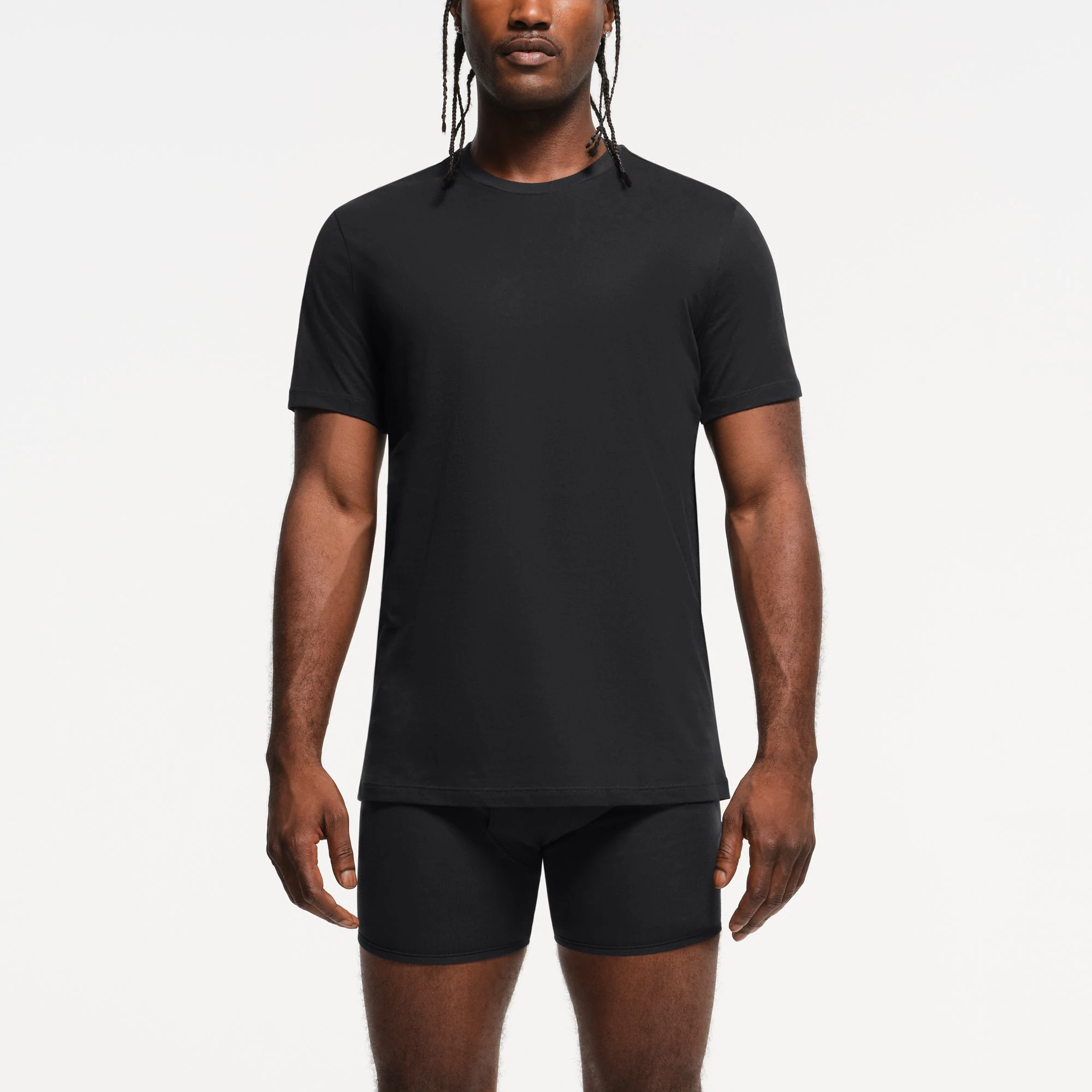 SKIMS BASICS MENS LIGHTWEIGHT T-SHIRT 3-PACK | OBSIDIAN ON A MODEL FRONT VIEW