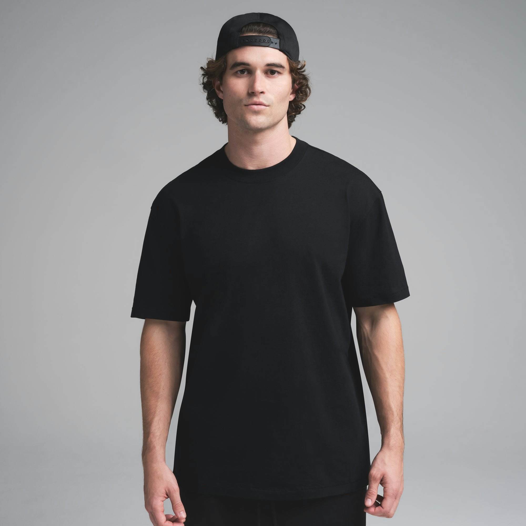 HEAVYWEIGHT COTTON MENS RELAXED T-SHIRT | OBSIDIAN ON A MODEL SIDE VIEW | FOCUS: 0.0, 1.0, 0.9