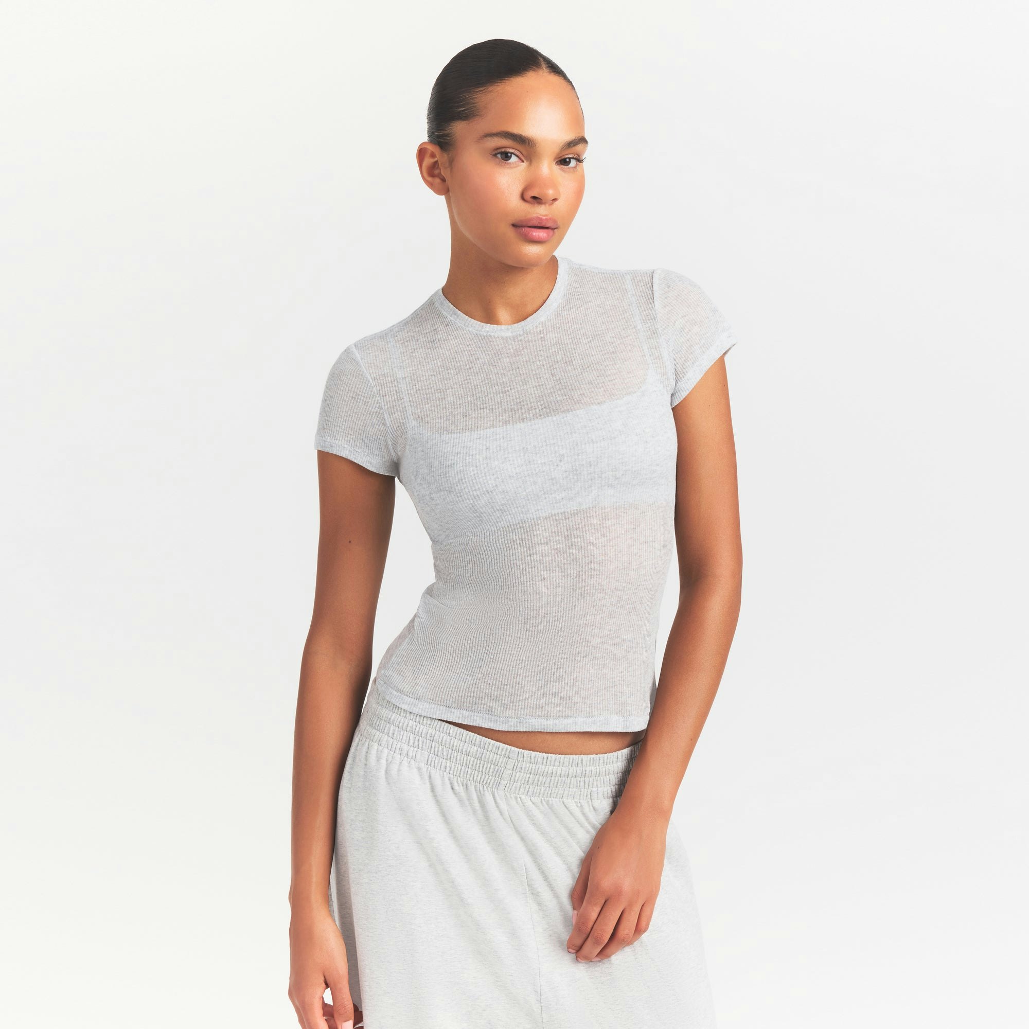 SHEER RIB T-SHIRT | LIGHT HEATHER GREY ON A MODEL SIDE VIEW @ | FOCUS: 0.0, 1.0, 0.9