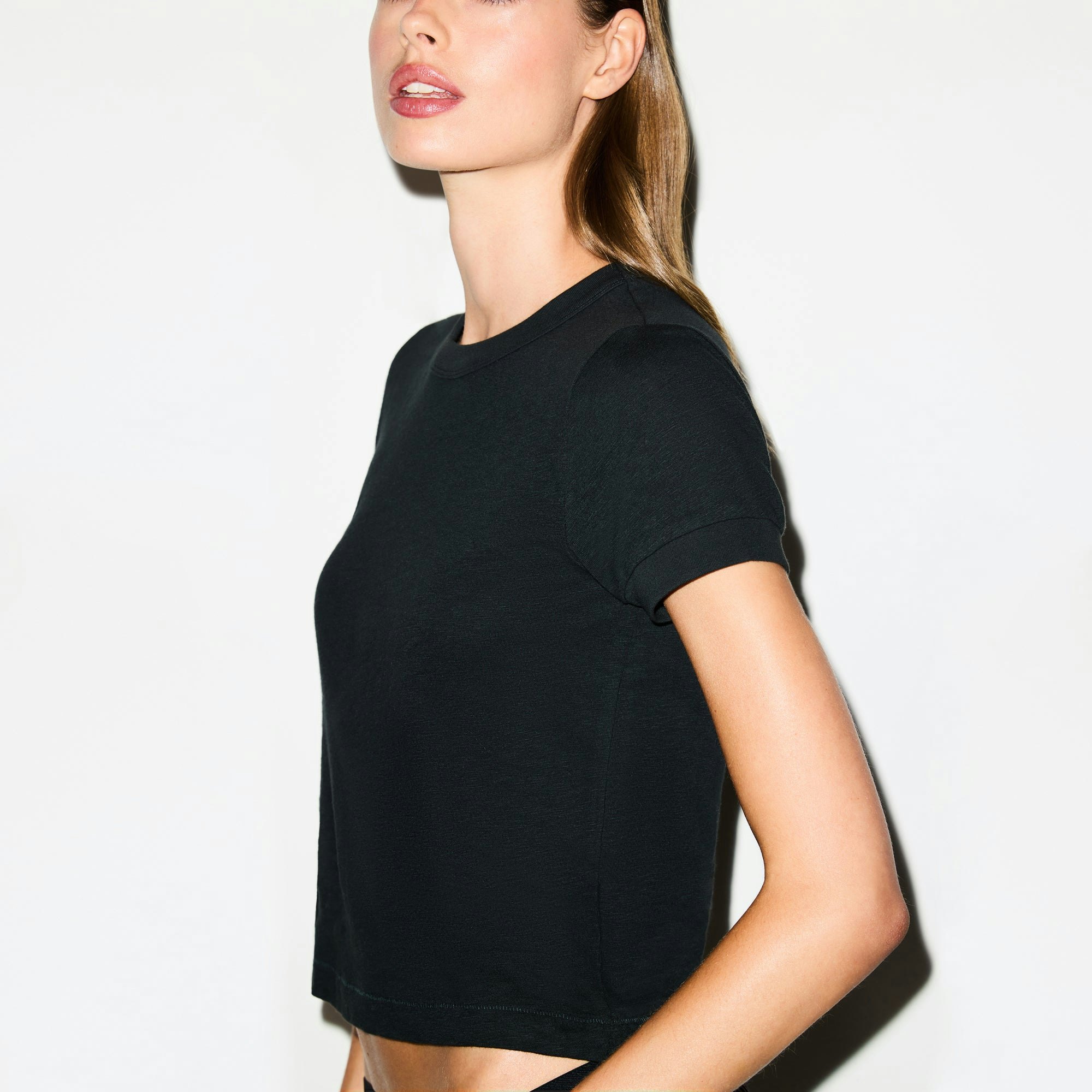 WORN IN JERSEY BABY TEE | ONYX ON A MODEL SIDE VIEW @ | FOCUS: 0.0, 1.0, 0.9