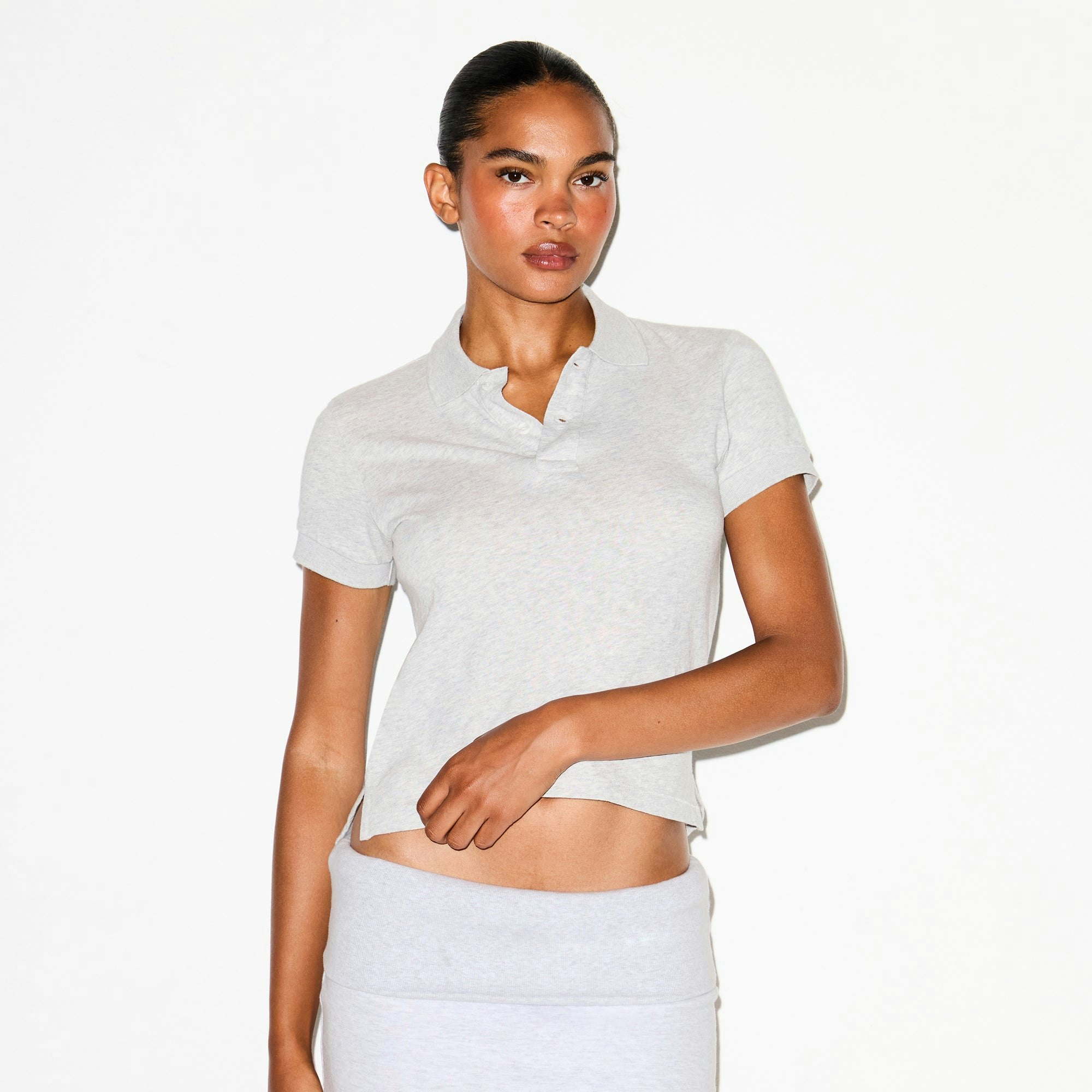 WORN IN JERSEY POLO | LIGHT HEATHER GREY ON A MODEL SIDE VIEW @ | FOCUS: 0.0, 1.0, 0.9