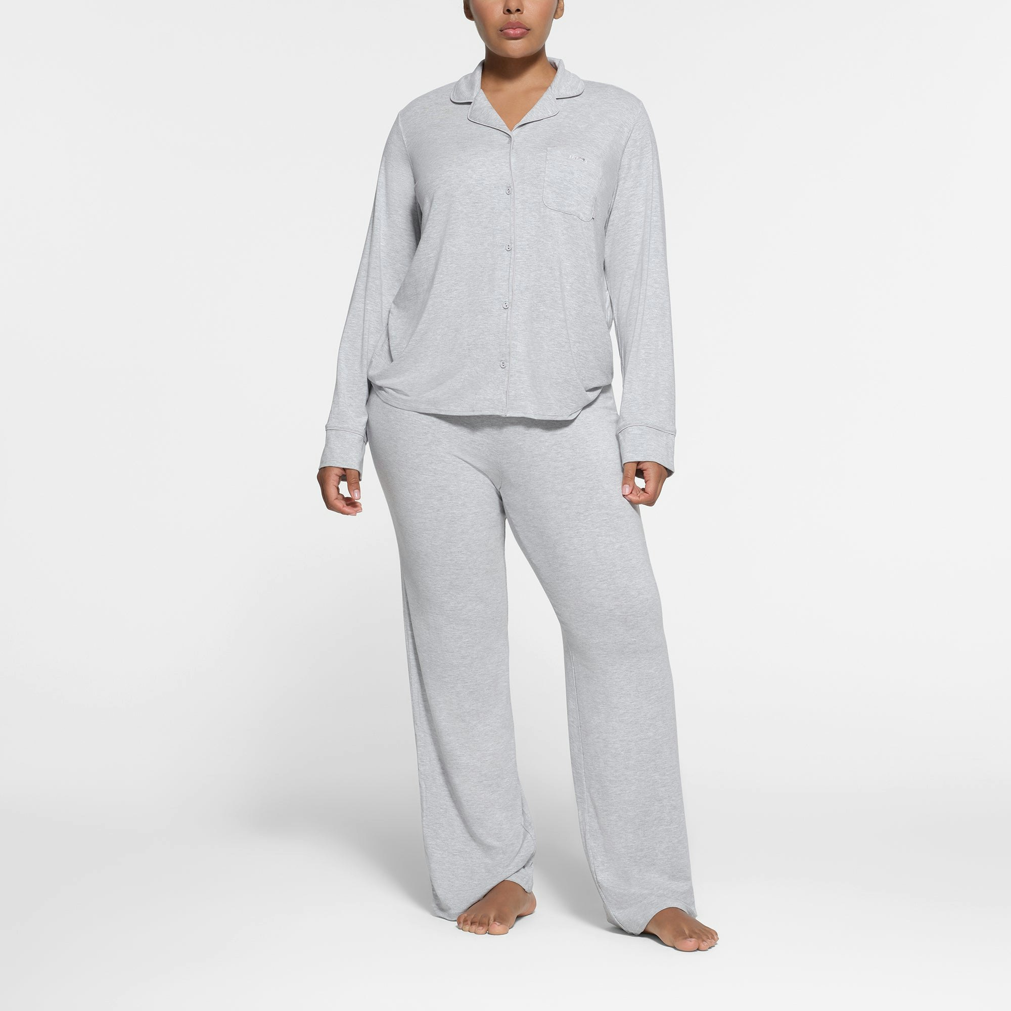 SKIMS SLEEP LONG SLEEVE BUTTON UP SET | LIGHT HEATHER GREY ON A MODEL FRONT VIEW