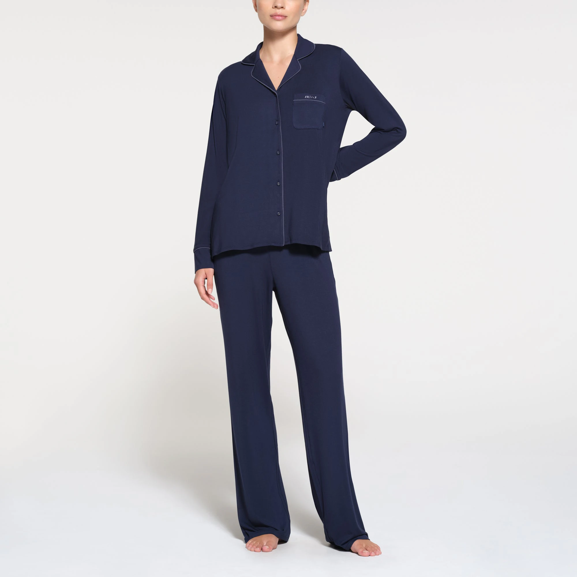 SKIMS SLEEP LONG SLEEVE BUTTON UP SET | NAVY ON A MODEL FRONT VIEW | SEE: XXS, XS, S