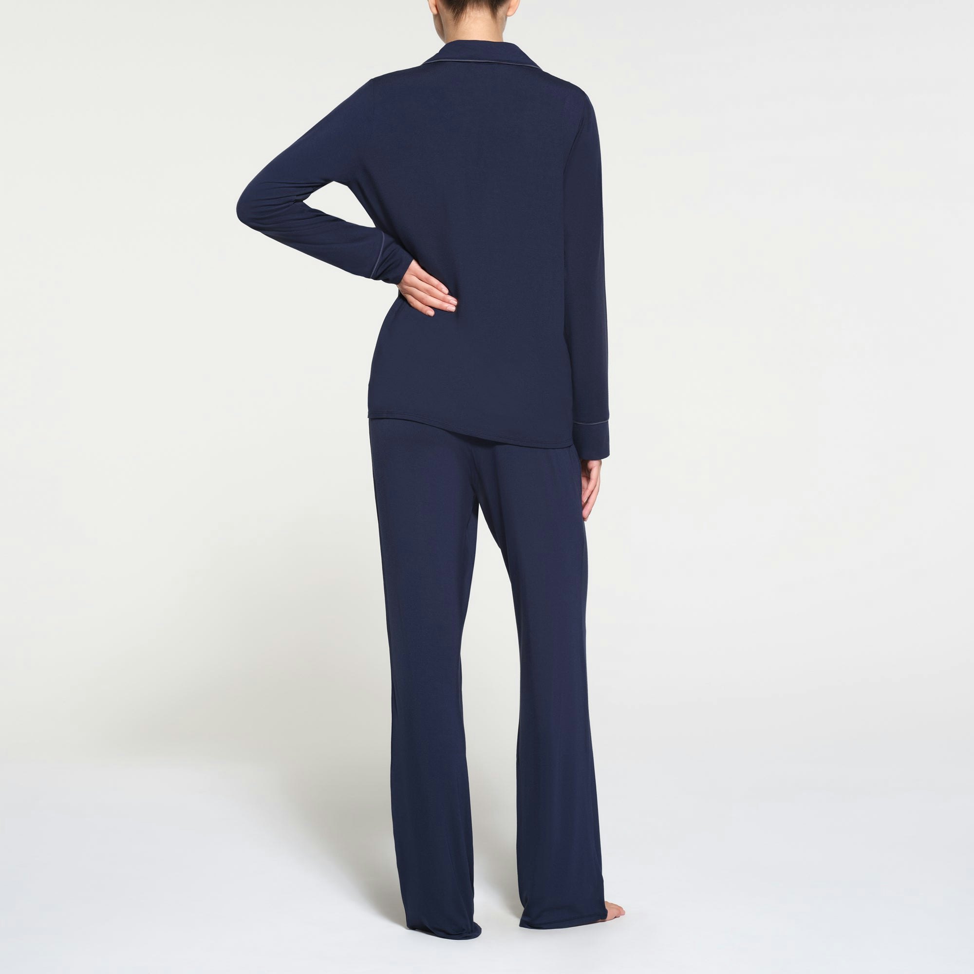 SKIMS SLEEP LONG SLEEVE BUTTON UP SET | NAVY ON A MODEL BACK VIEW