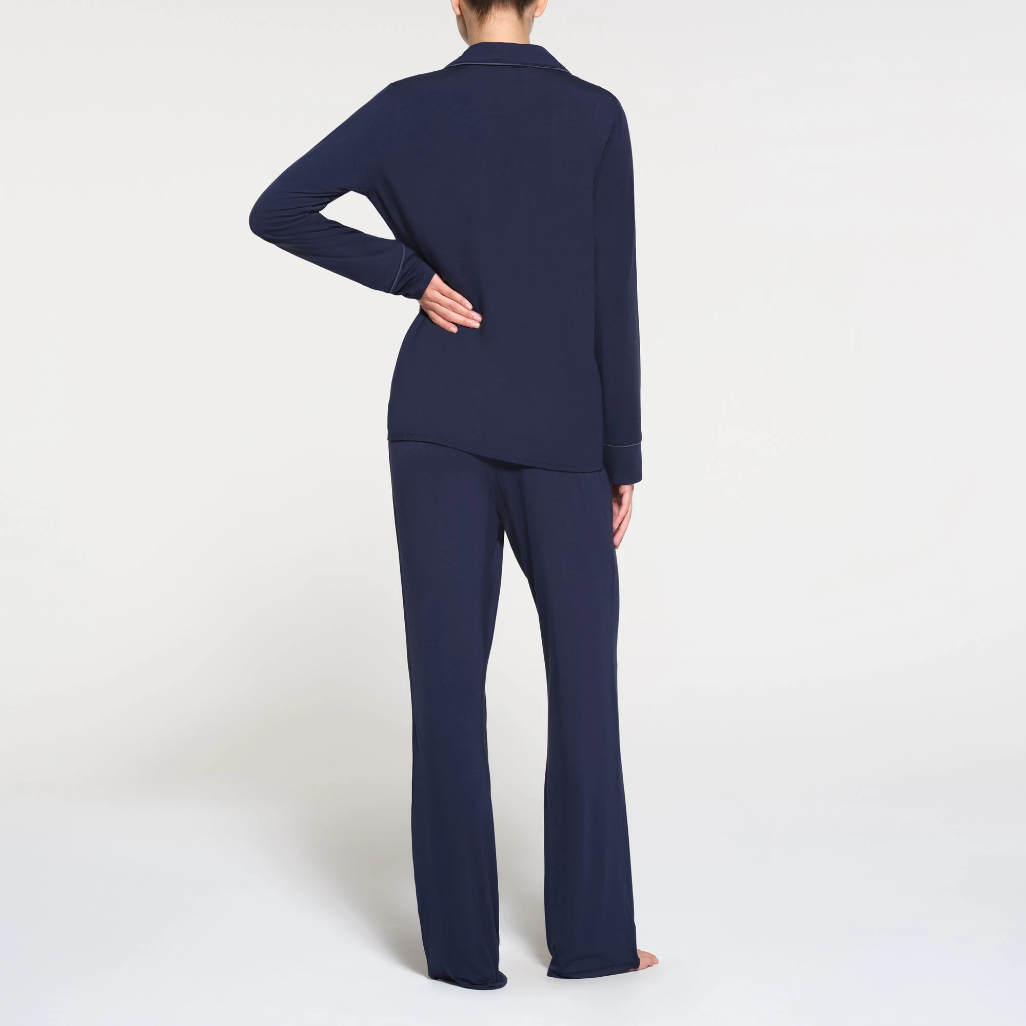 SKIMS SLEEP LONG SLEEVE BUTTON UP SET | NAVY ON A MODEL BACK VIEW