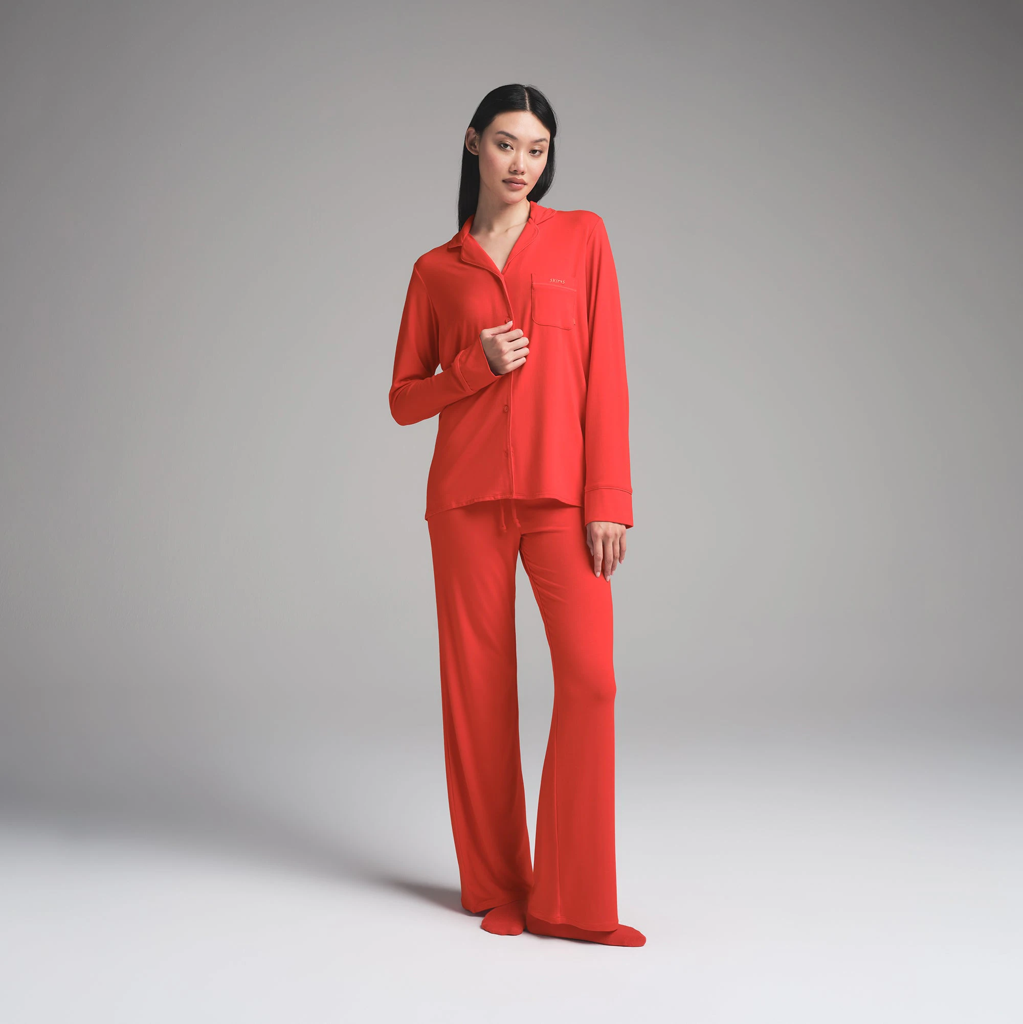 SKIMS SLEEP LONG SLEEVE BUTTON UP SET | RUBY ON A MODEL FRONT VIEW | FOCUS: 0.0, 1.0, 0.9