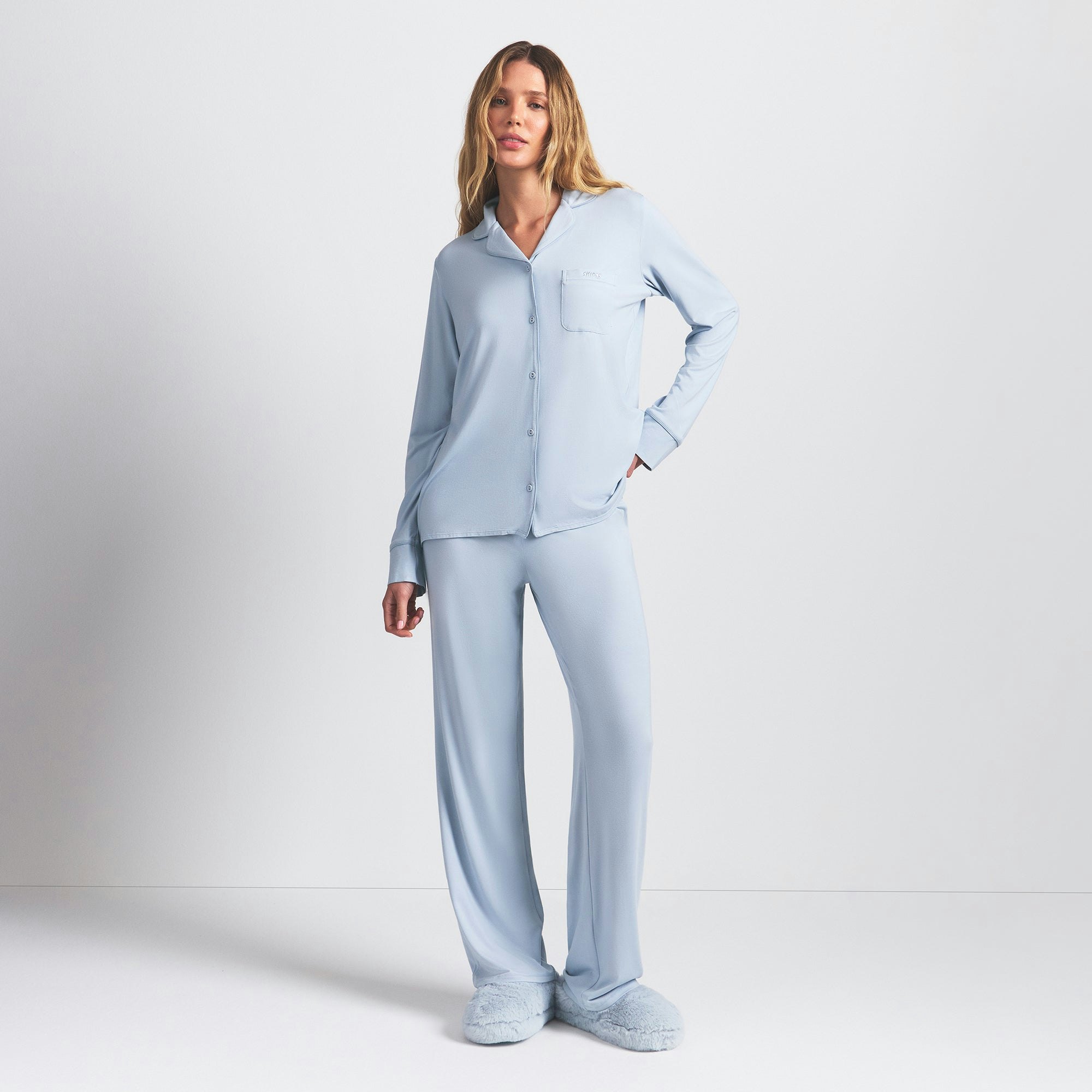 SKIMS SLEEP LONG SLEEVE BUTTON UP SET | ZEN BLUE ON A MODEL FRONT VIEW @ | FOCUS: 0.0, 1.0, 0.9