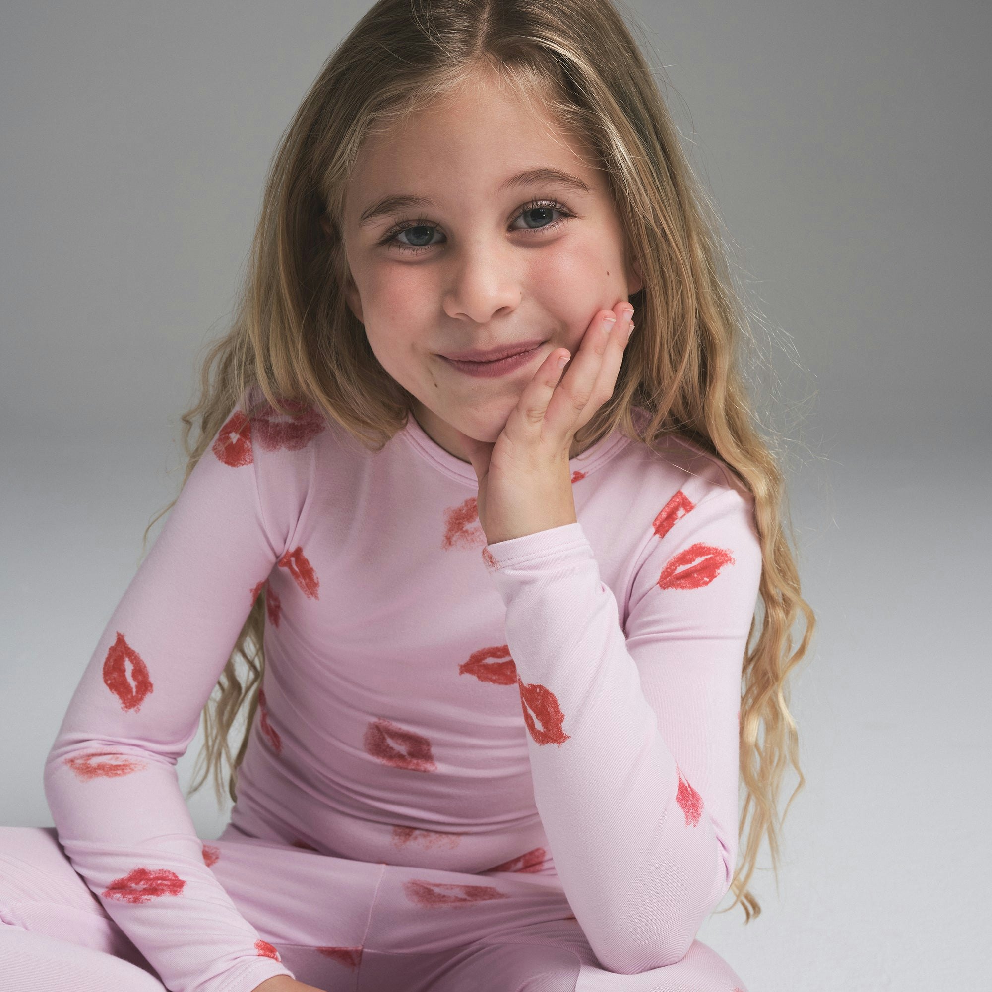 SKIMS SLEEP KIDS SLEEP SET | CHERRY BLOSSOM LIPSTICK ON A MODEL SIDE VIEW | FOCUS: 0.0, 1.0, 0.9