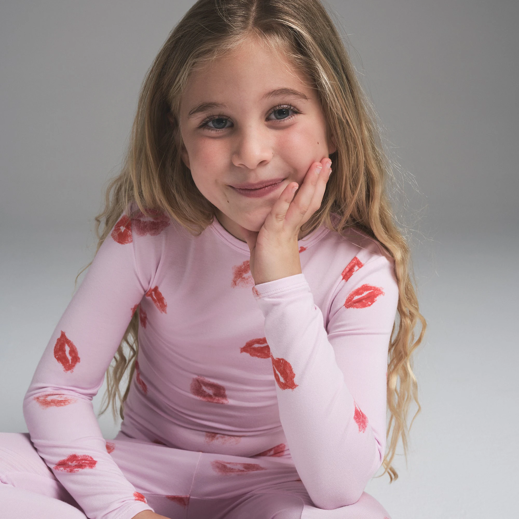 SKIMS SLEEP KIDS SLEEP SET | CHERRY BLOSSOM LIPSTICK ON A MODEL SIDE VIEW | FOCUS: 0.0, 1.0, 0.9