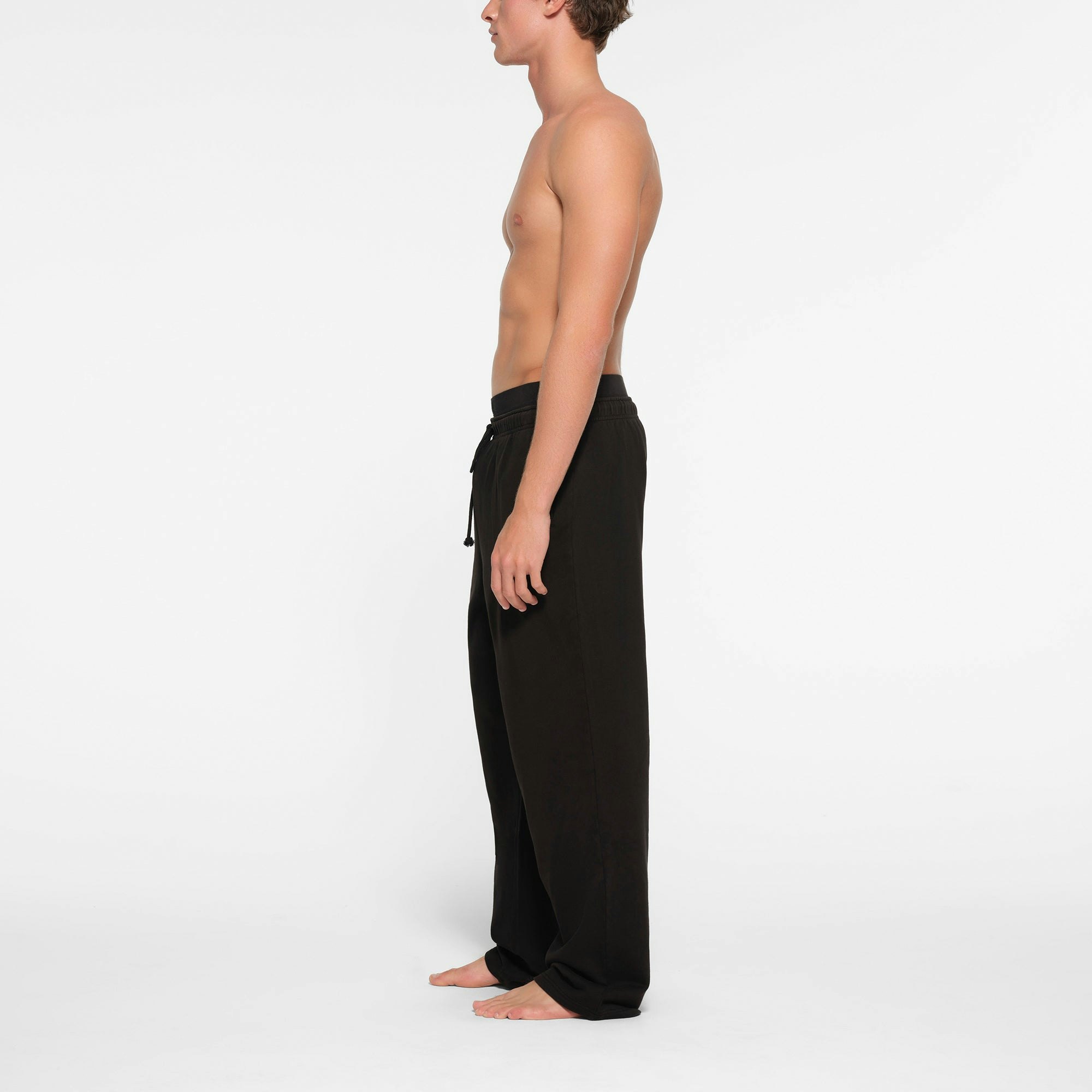 TERRY MENS STRAIGHT LEG PANT | WASHED OBSIDIAN ON A MODEL SIDE VIEW