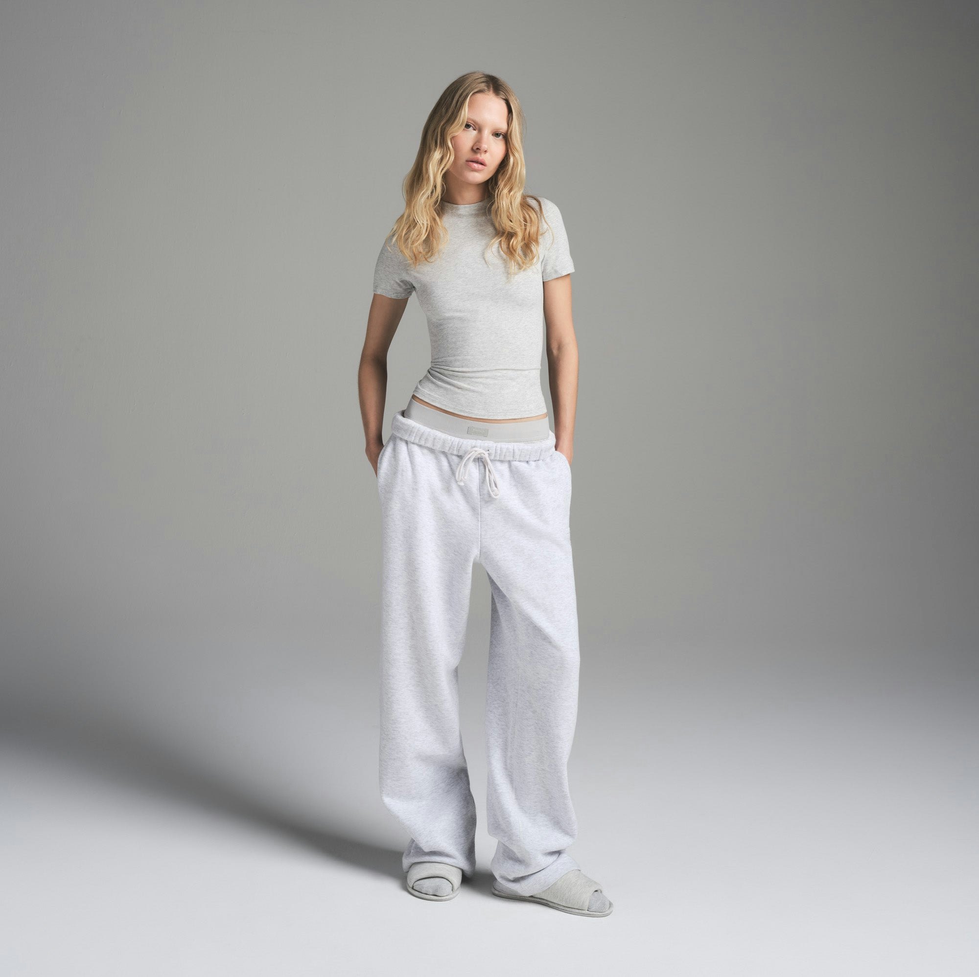COTTON FLEECE CLASSIC STRAIGHT LEG PANT | LIGHT HEATHER GREY ON A MODEL FRONT VIEW | FOCUS: 0.0, 1.0, 0.9